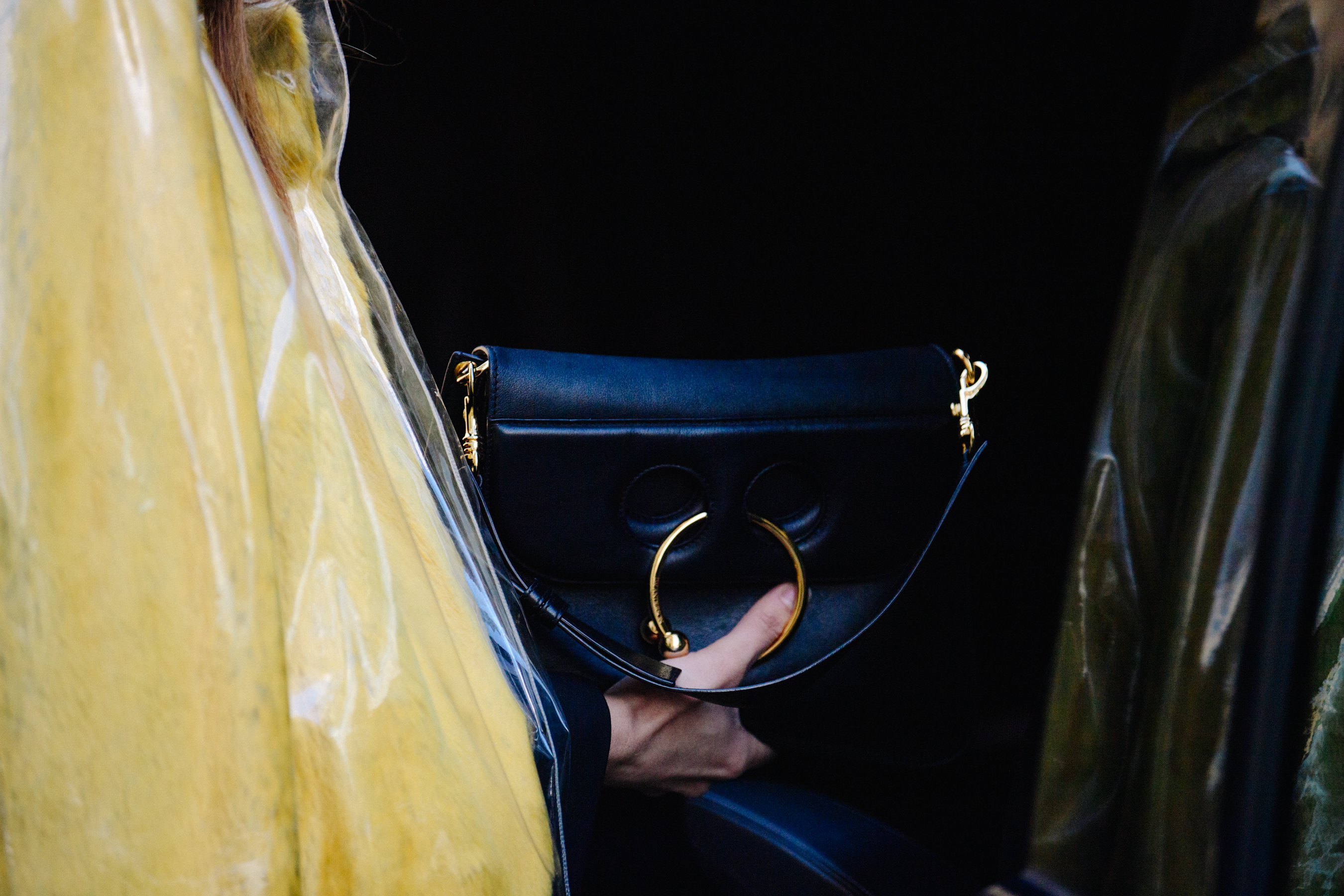 Woman carrying JW Anderson purse