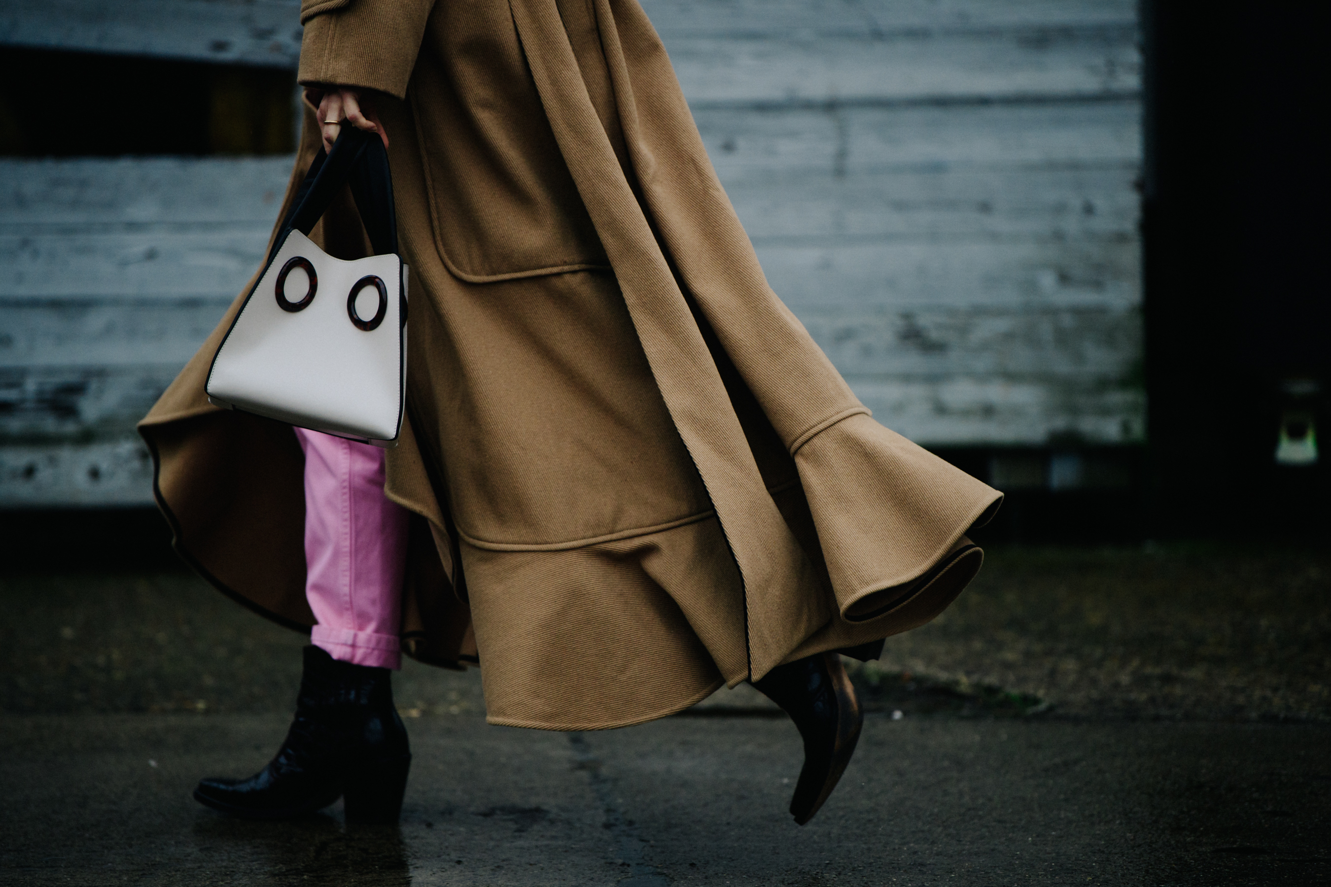 Woman carrying small white bag
