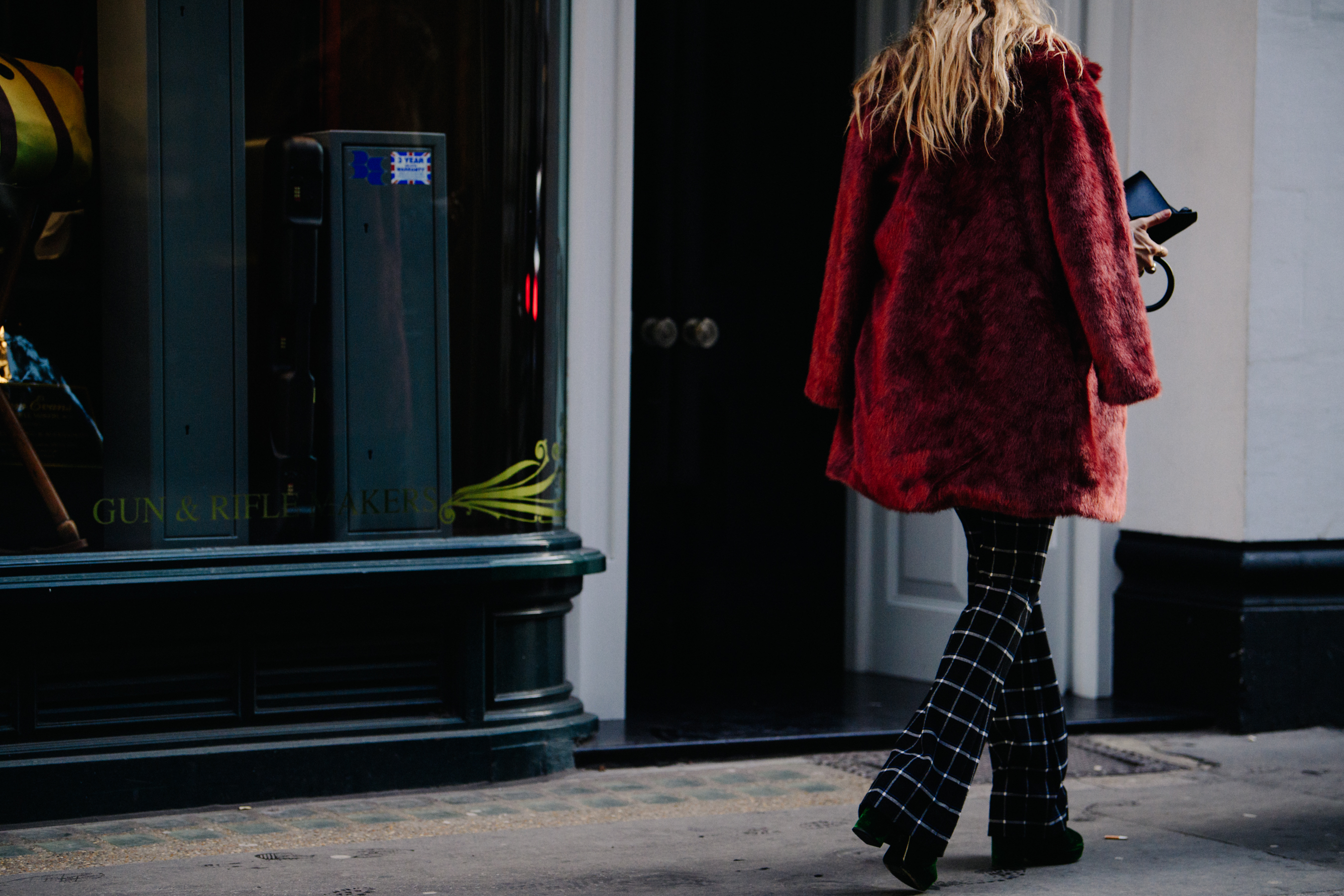 Woman wearing red fur jacket