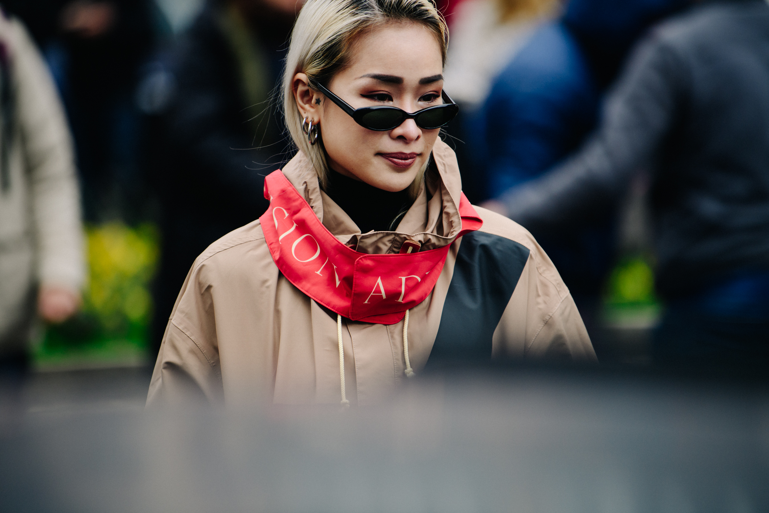 Woman wearing brown and red coat