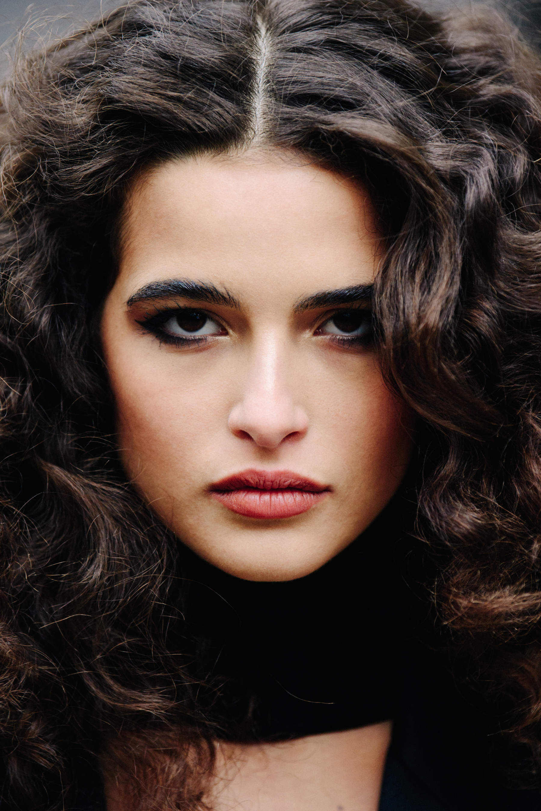 Portrait of Italian model with thick curly hair