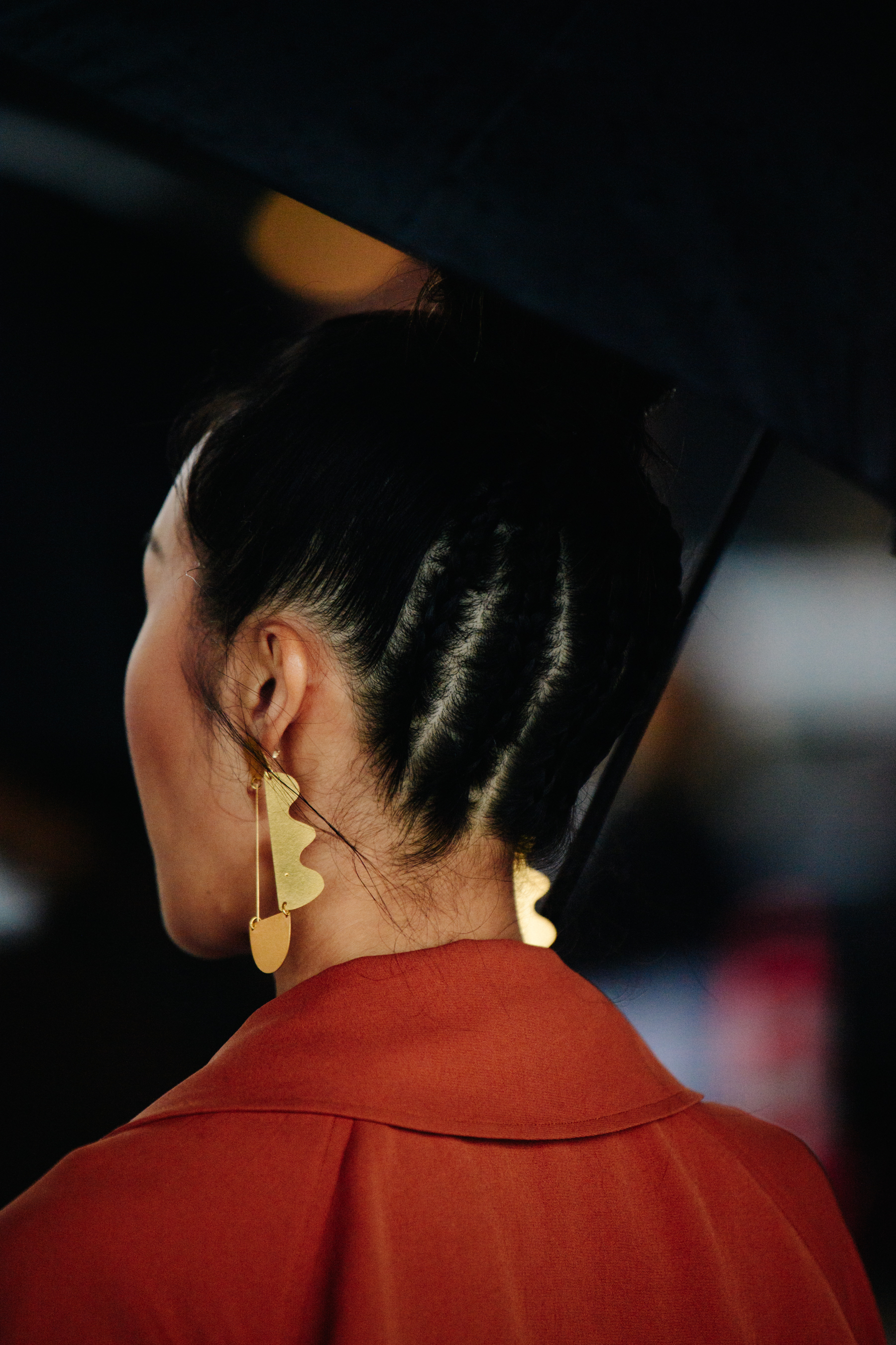 Woman wearing gold earrings