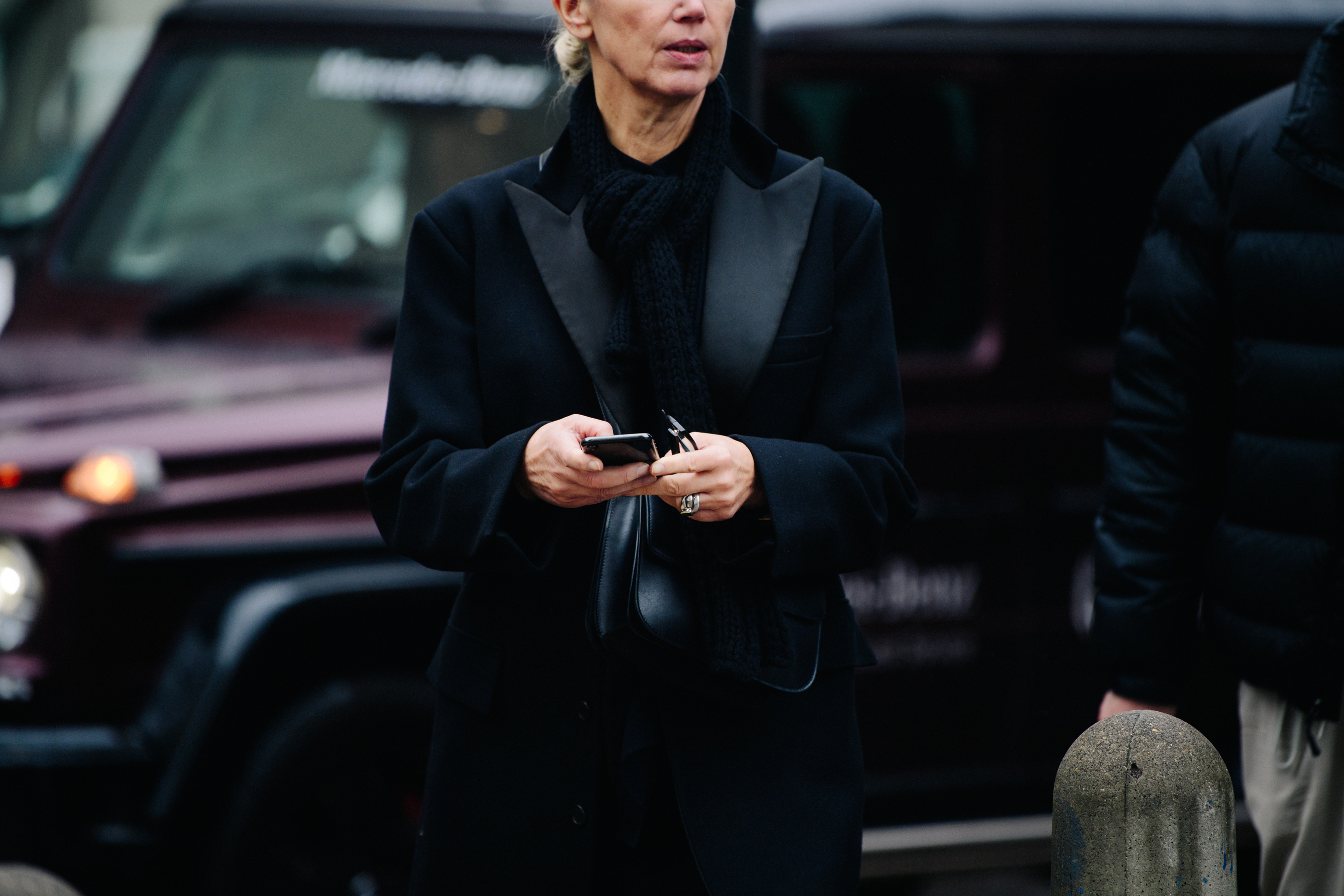 Editor wearing black coat