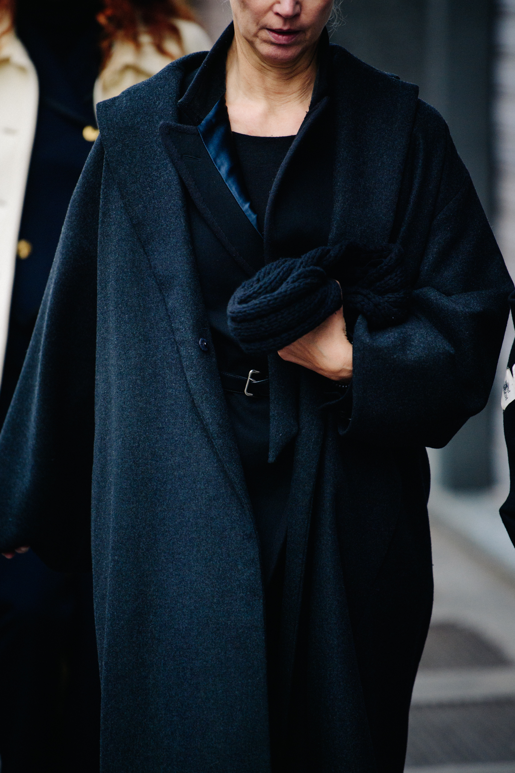 French woman wearing black wool coat
