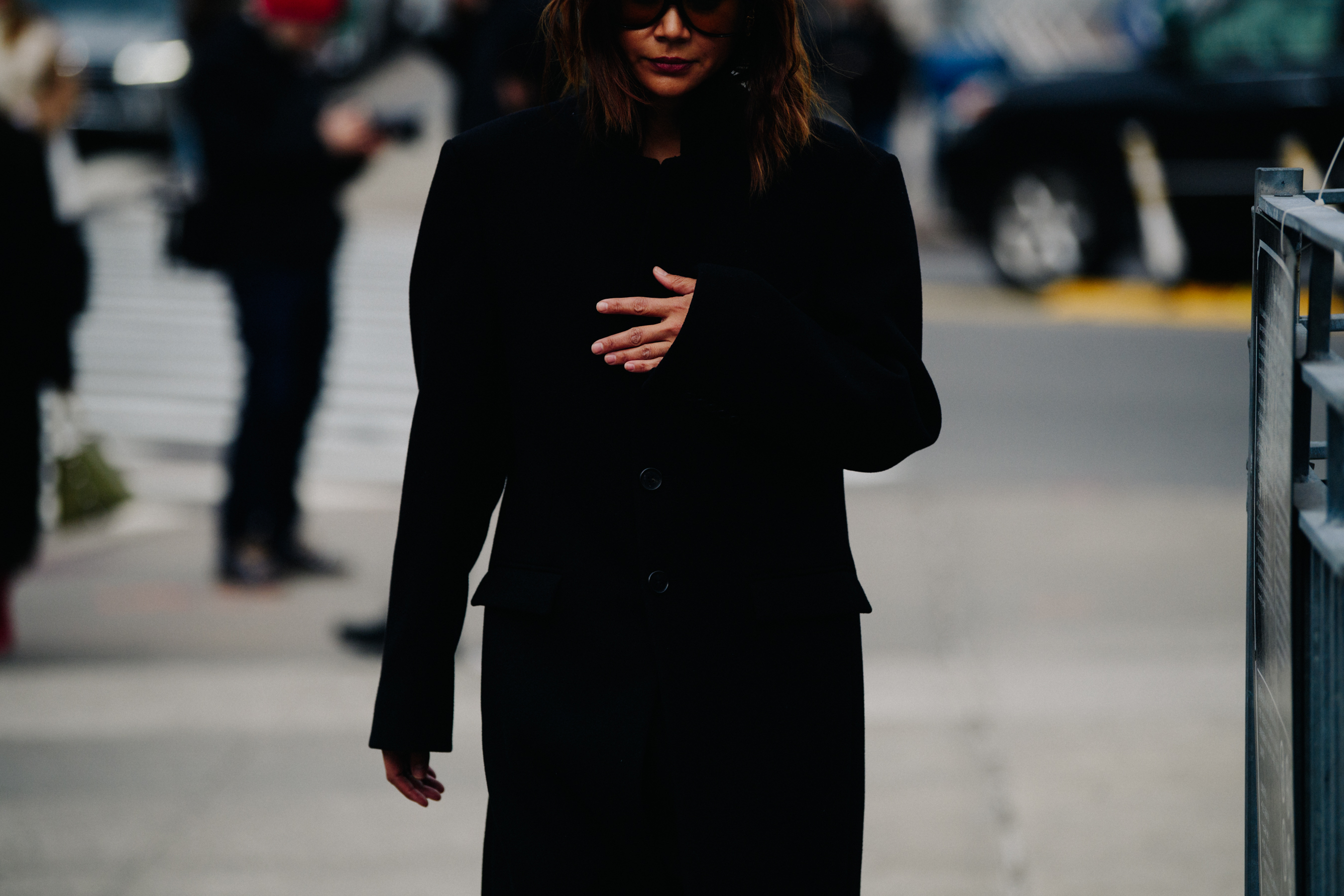 Stylist wearing black coat