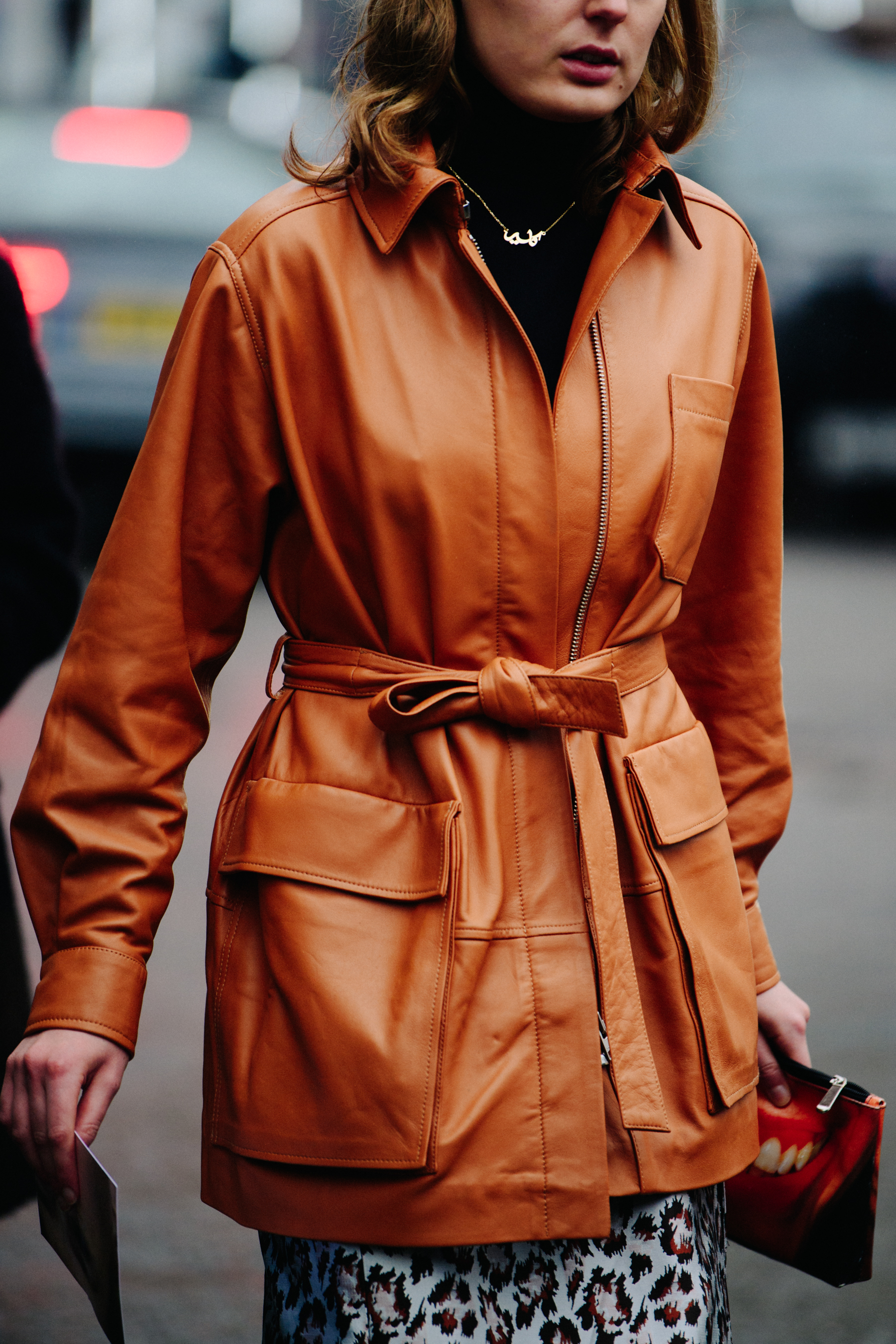 Woman wearing brown leather jacket