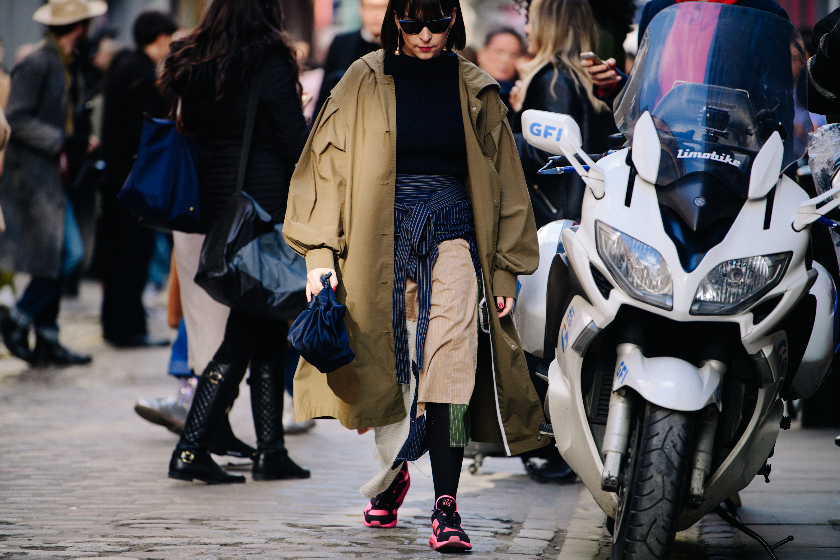 Woman wearing long green coat