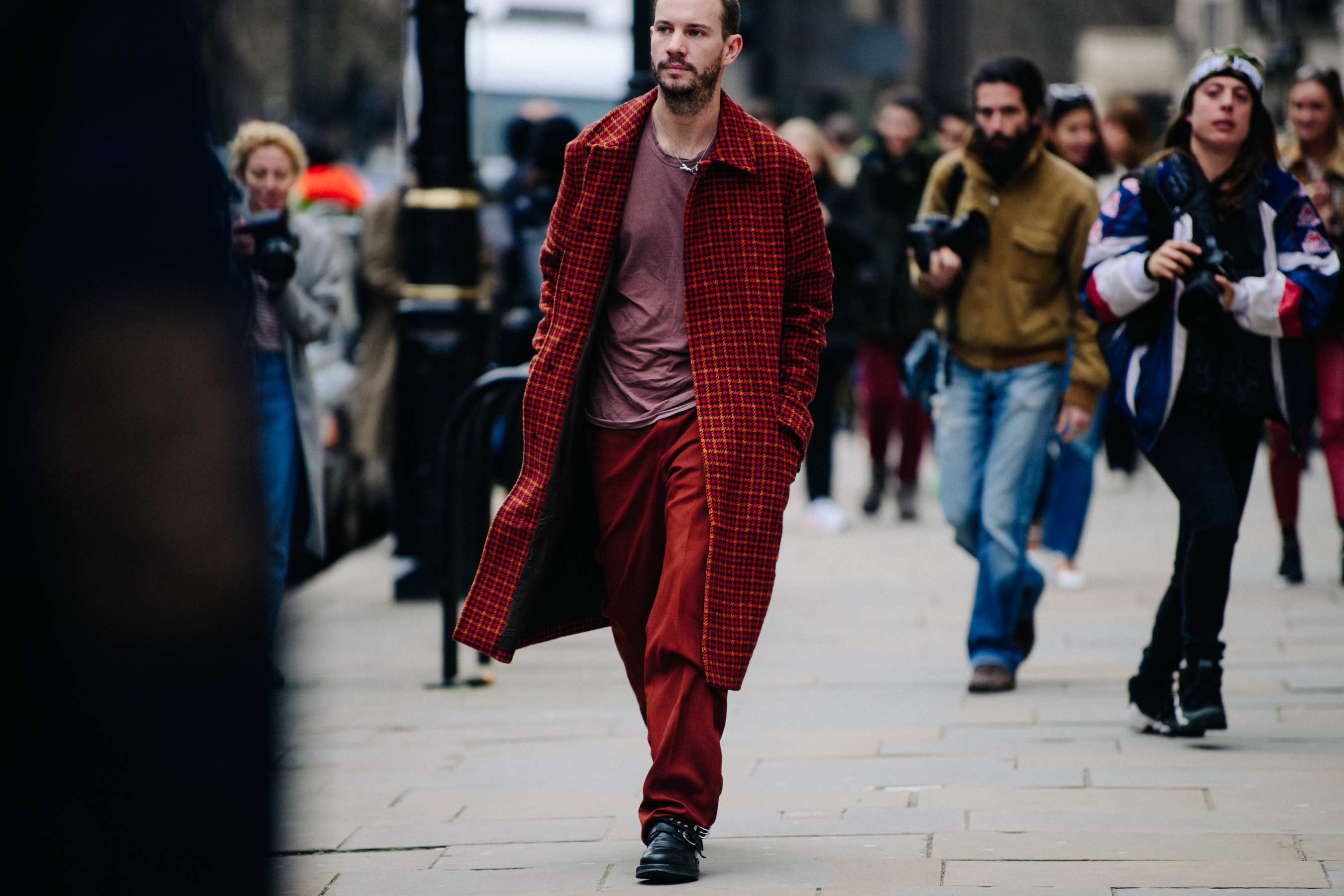 Editor wearing red outfit