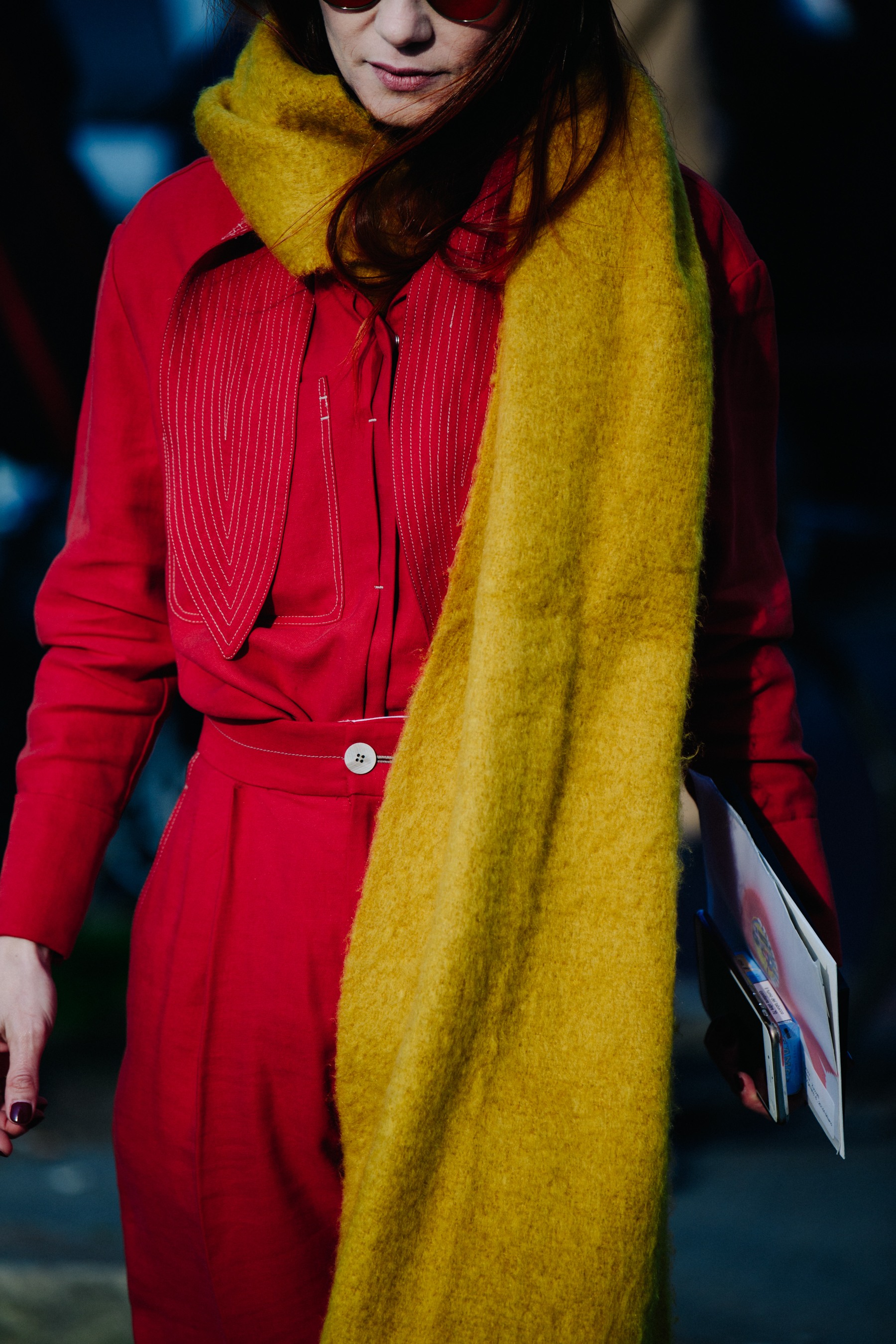 Woman wearing long yellow scarf
