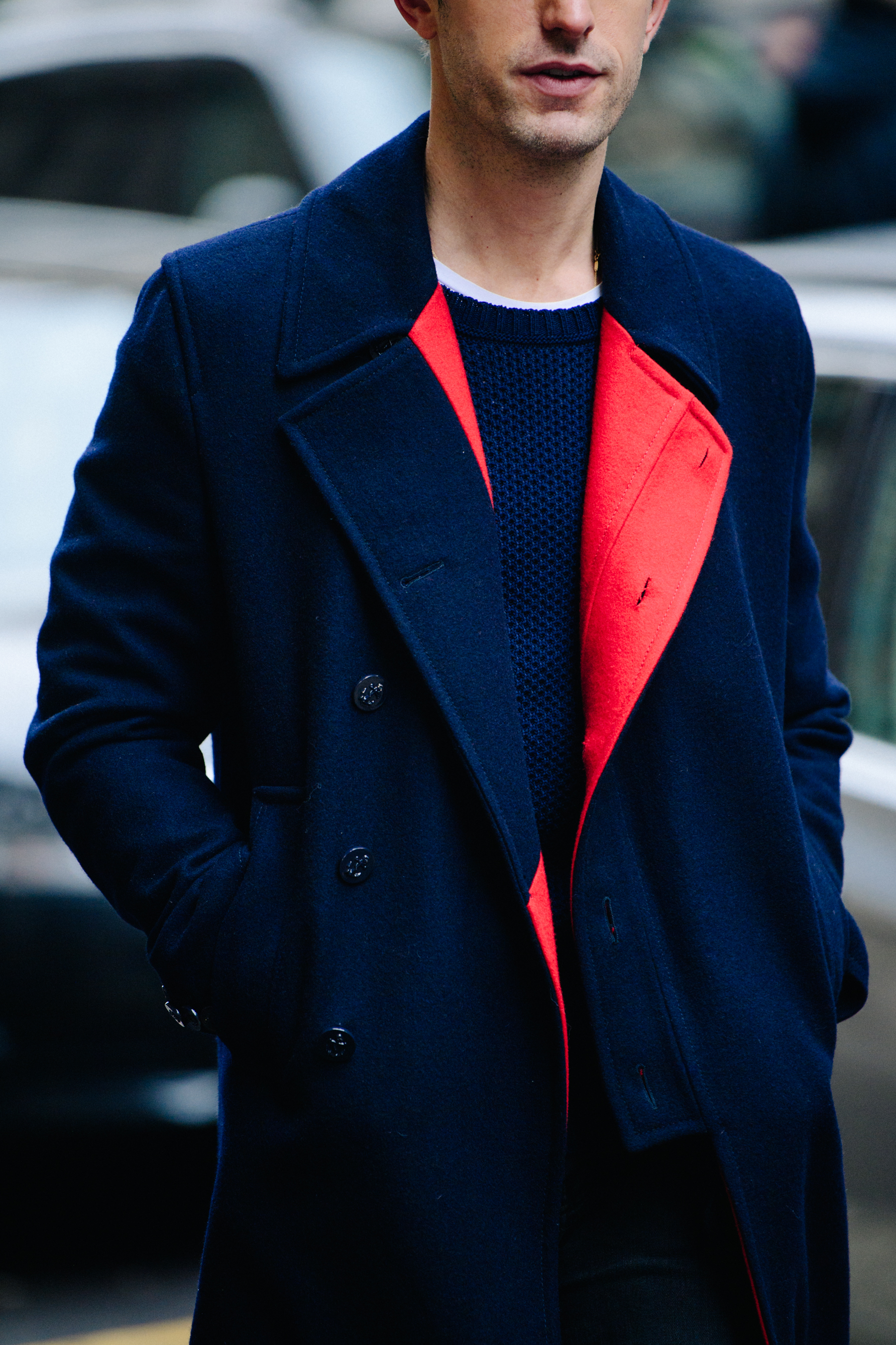 Man wearing red and blue winter coat