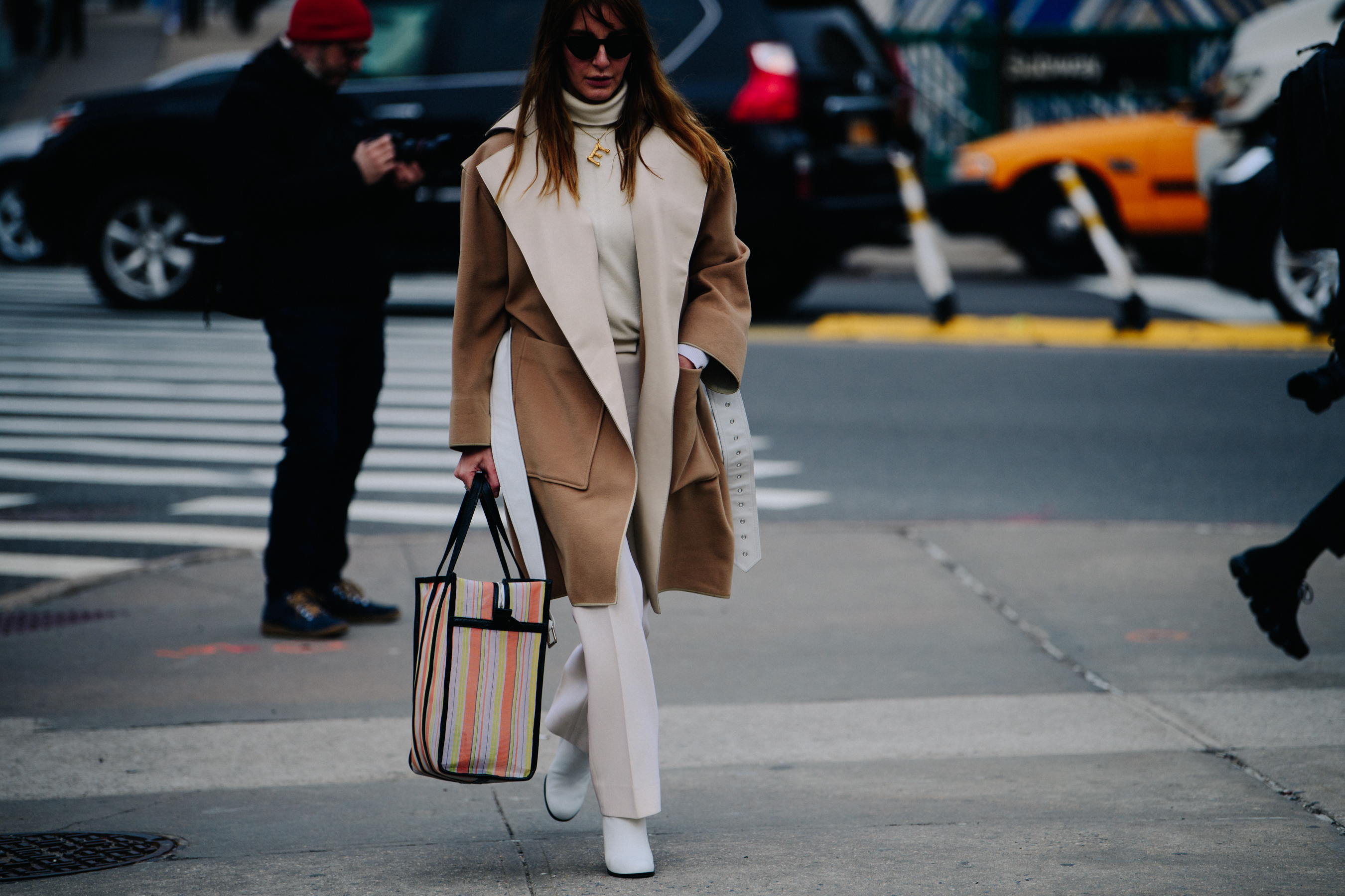 Woman wearing white and tan outfit