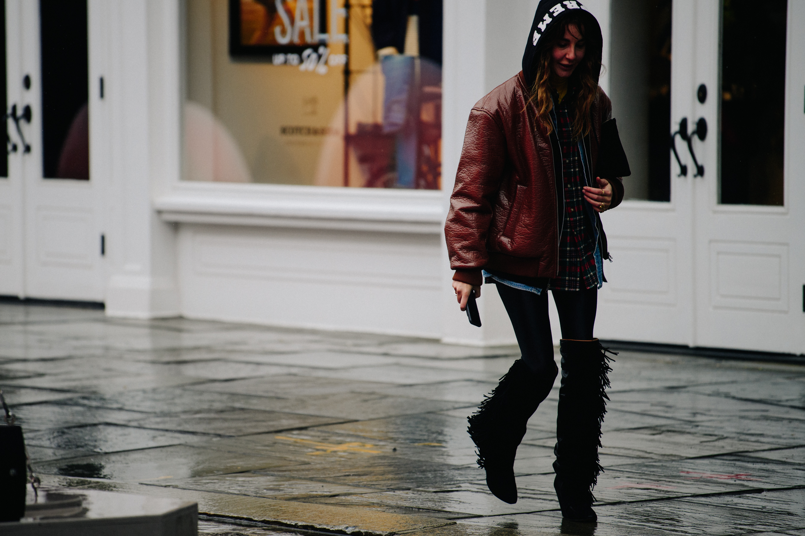 Woman wearing high tasseled boots