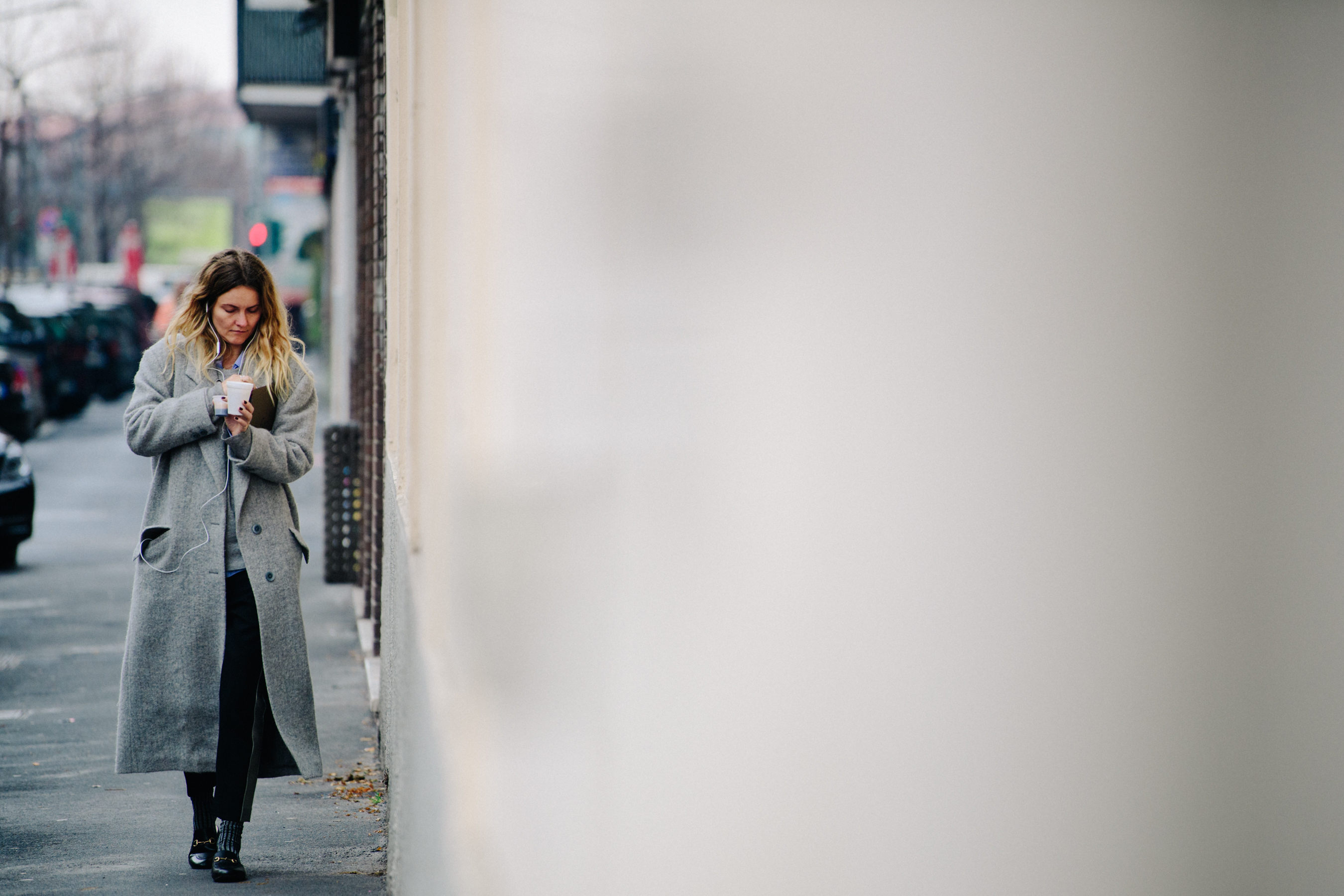 Woman wearing long grey coat