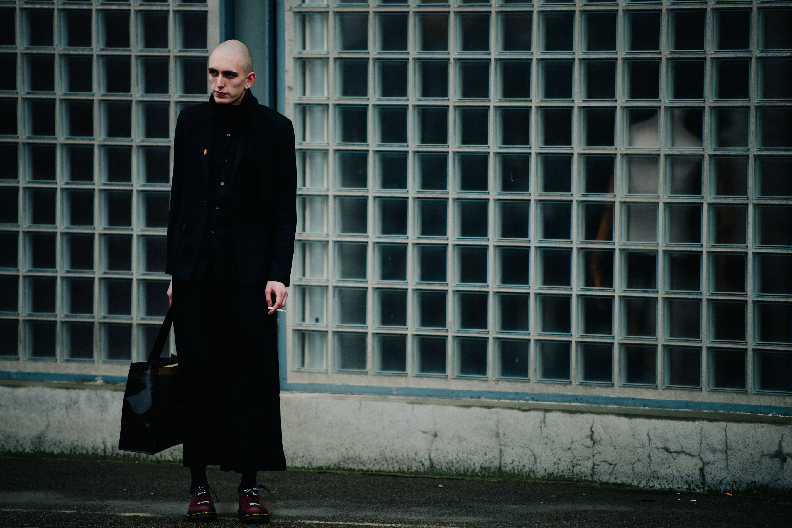 Danish man wearing long black coat