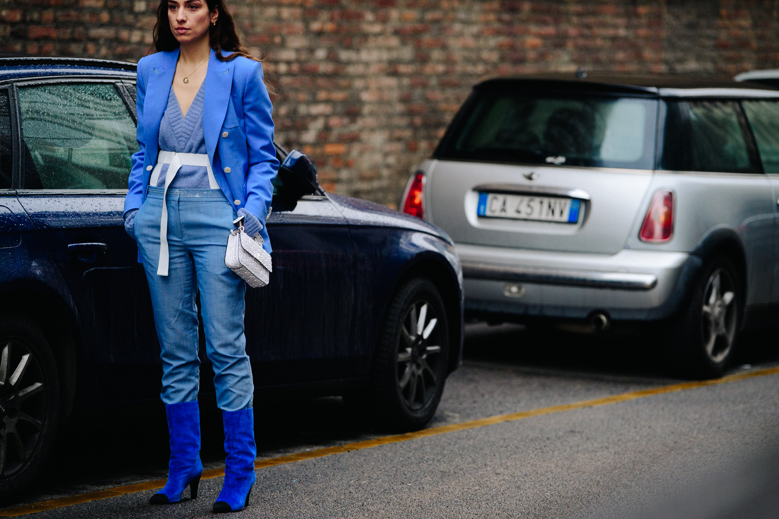 Italian woman wearing blue outfit