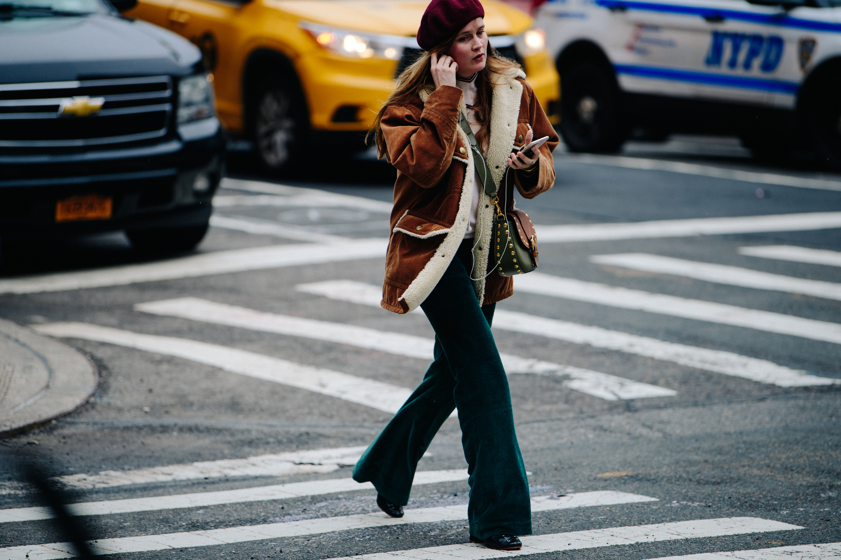 Woman wearing brown shearling jacket