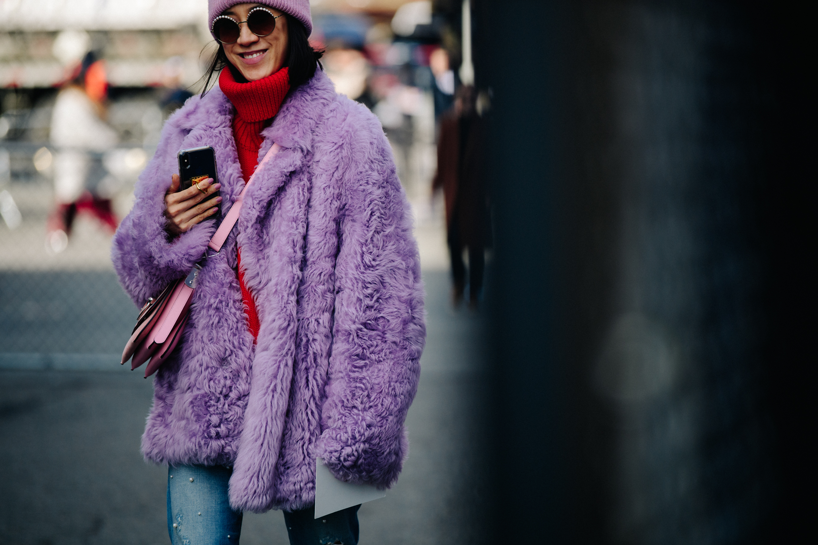 Woman wearing purple fur jacket