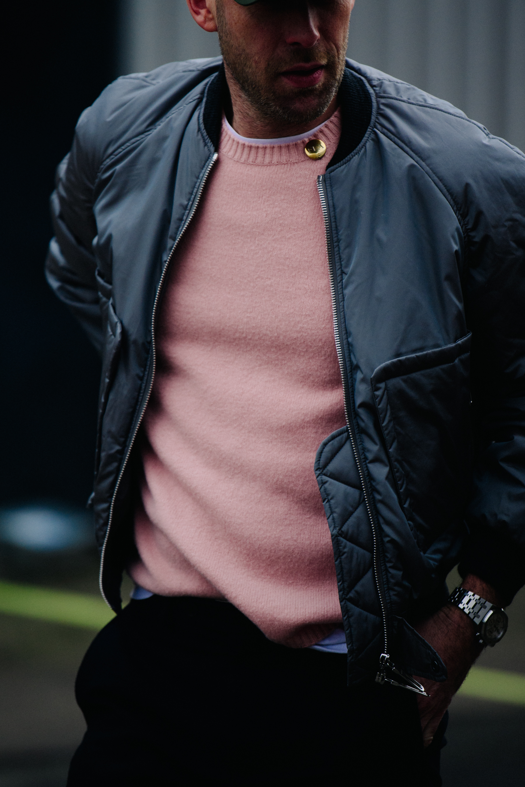 Man wearing pink jumper