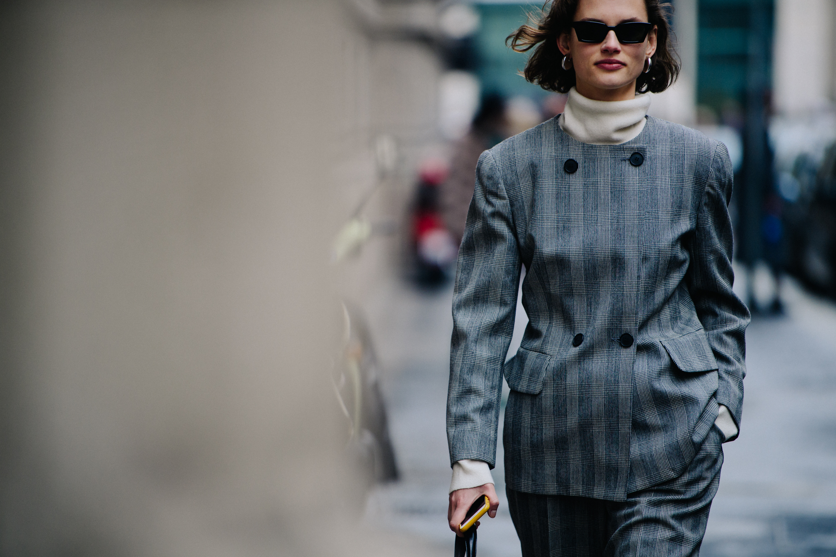 Model wearing grey check suit