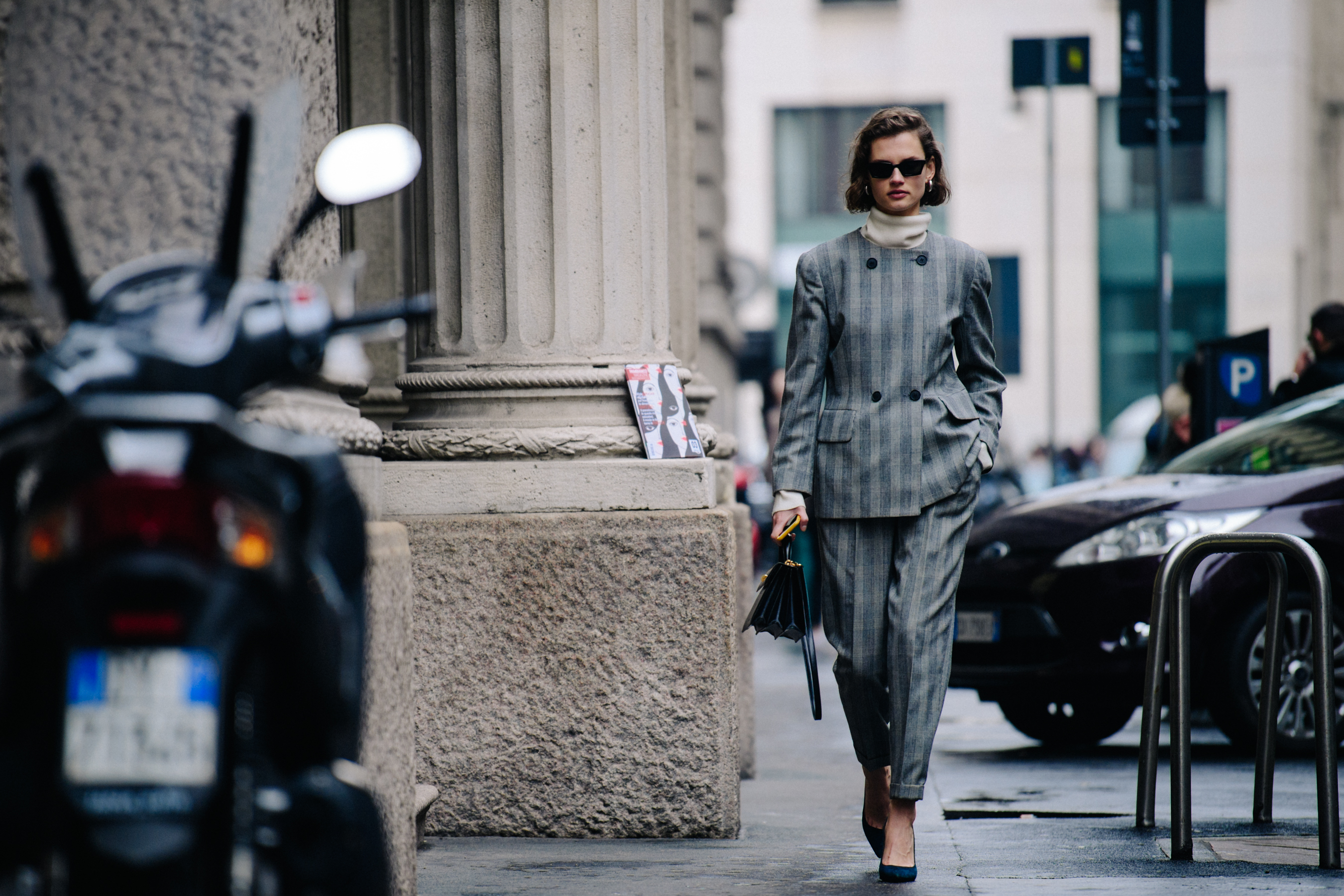 Model wearing grey check suit
