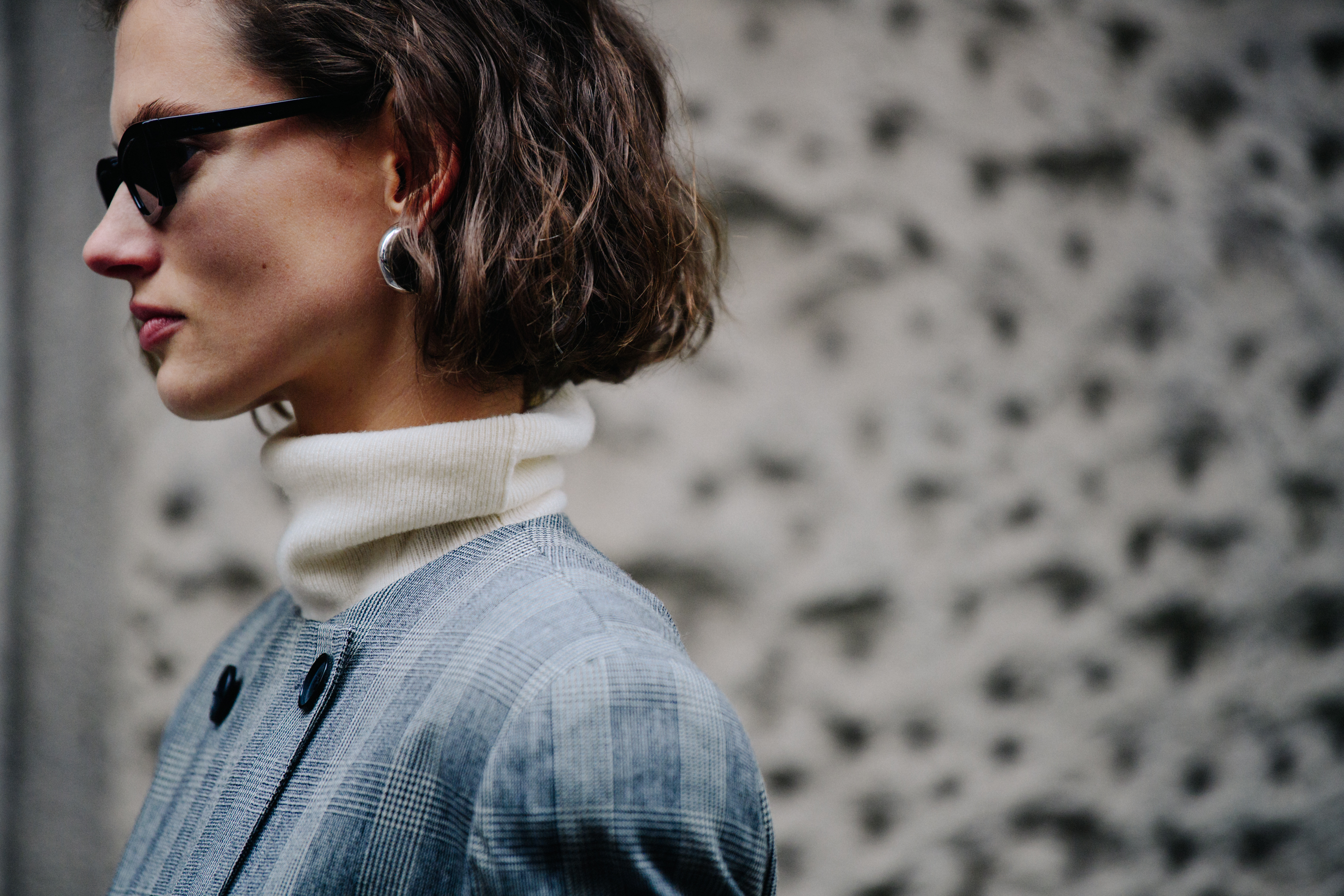Model wearing grey check suit