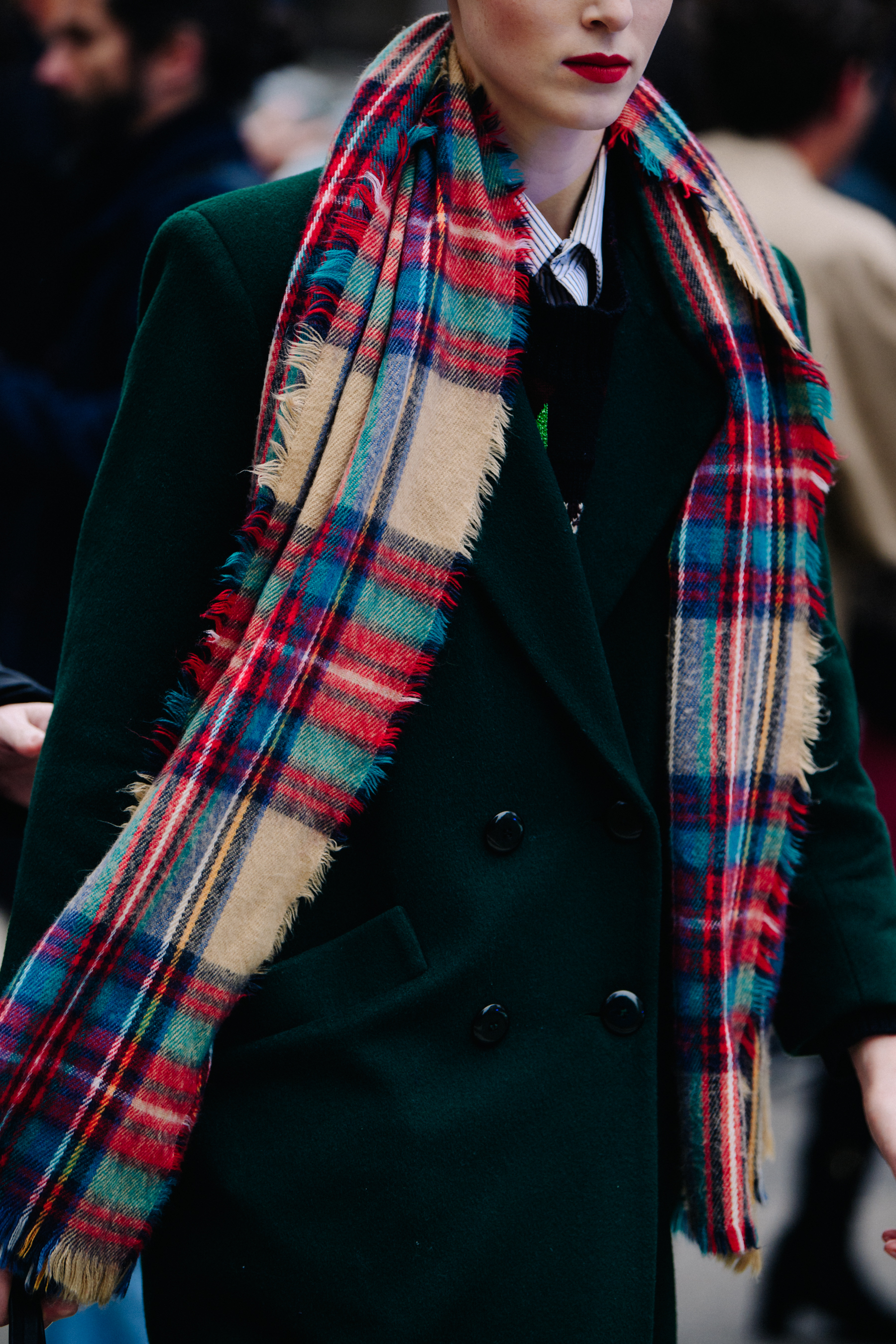 Model wearing colourful check scarf