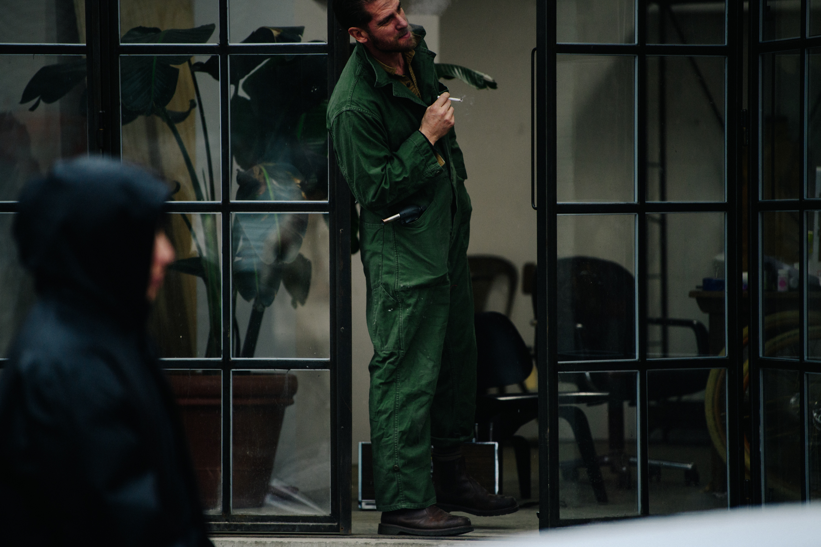 Man wearing green overalls