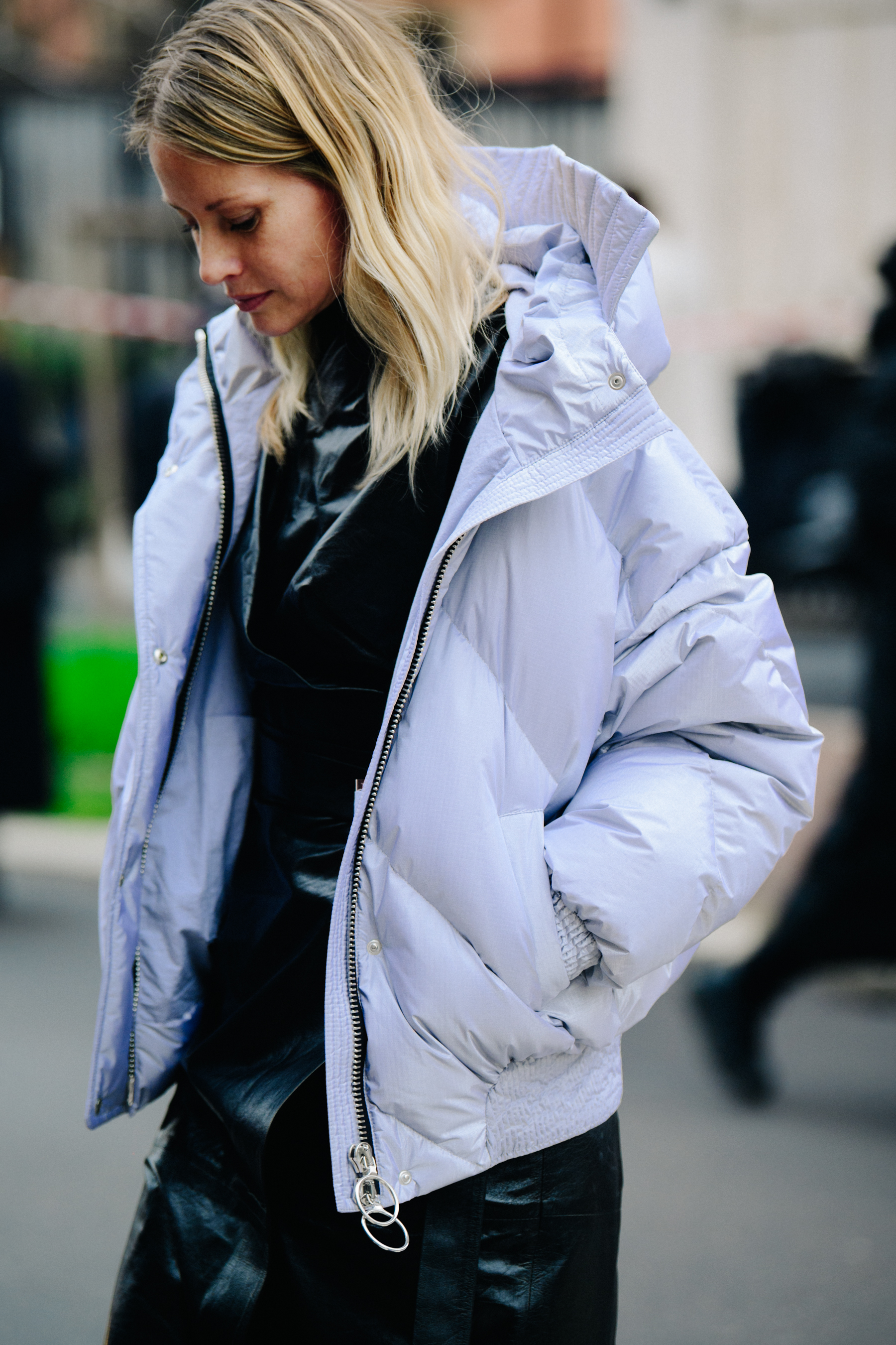 British woman wearing white coat