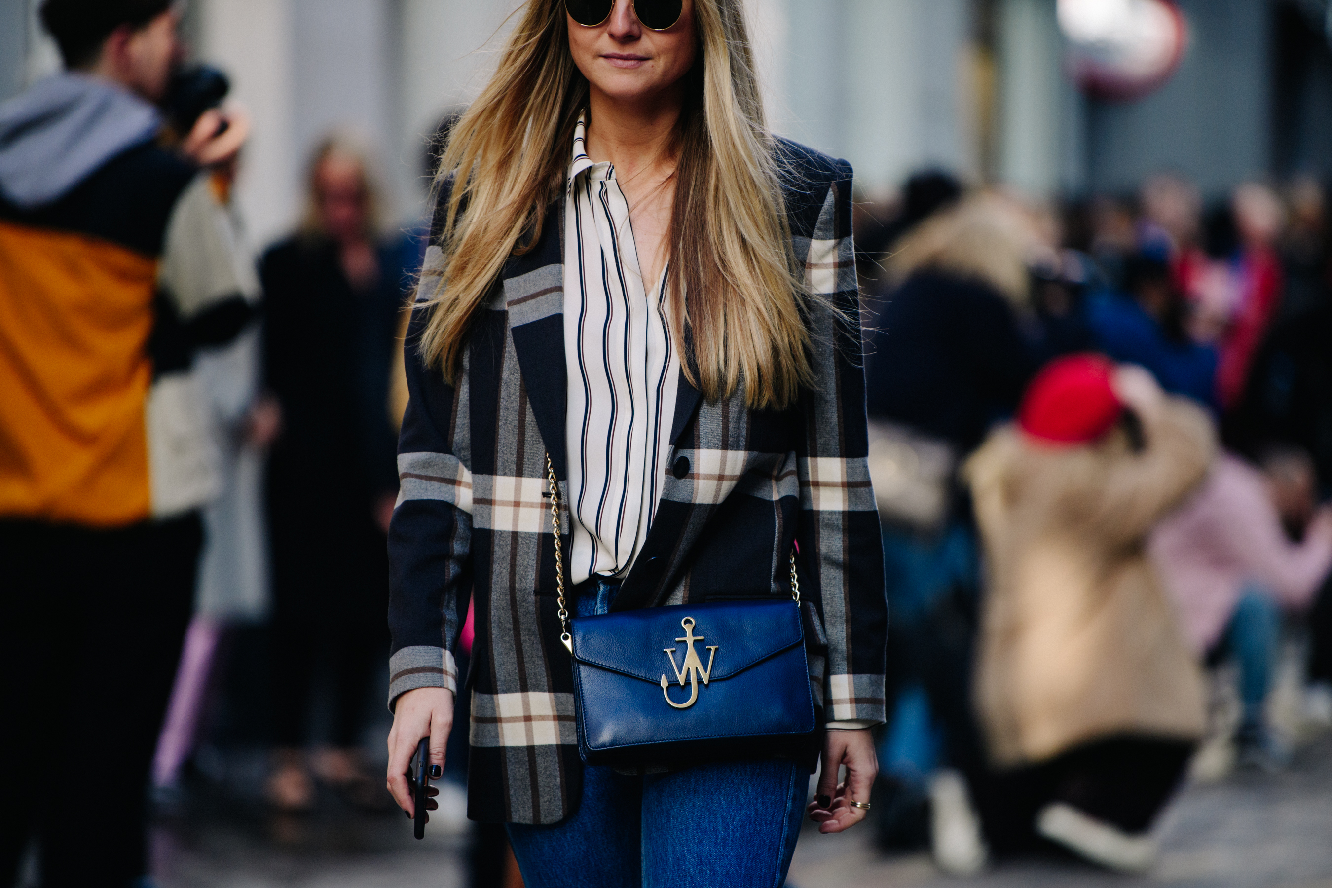 Woman carrying JW Anderson bag