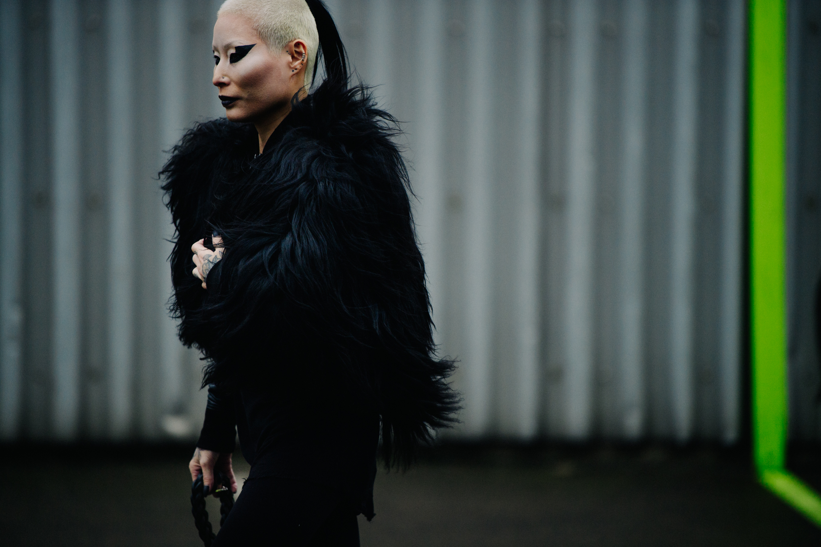 Woman wearing black fur outfit