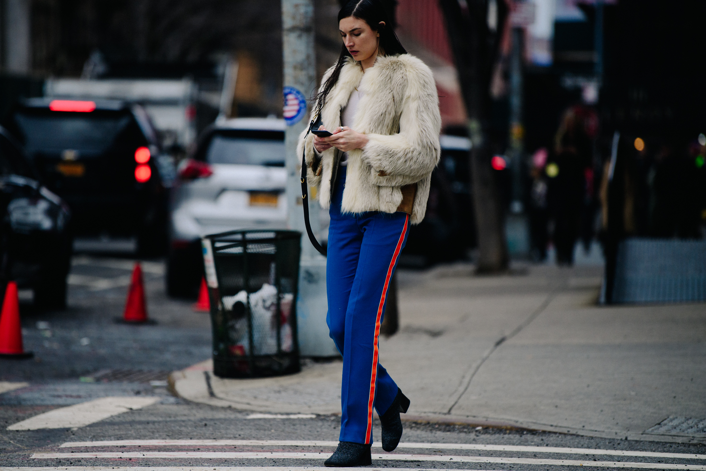 Model wearing white fur jacket