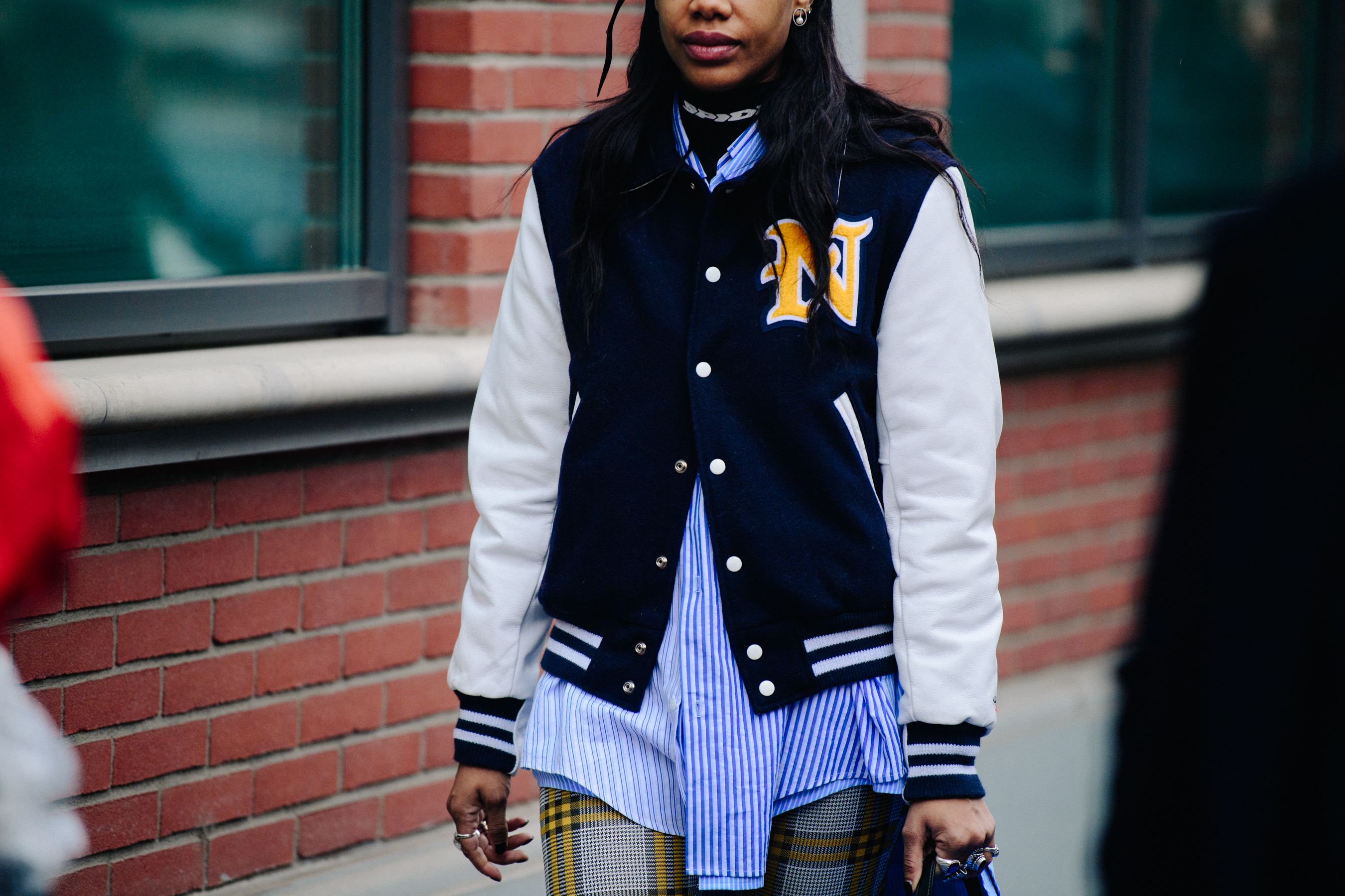Woman wearing varsity jacket