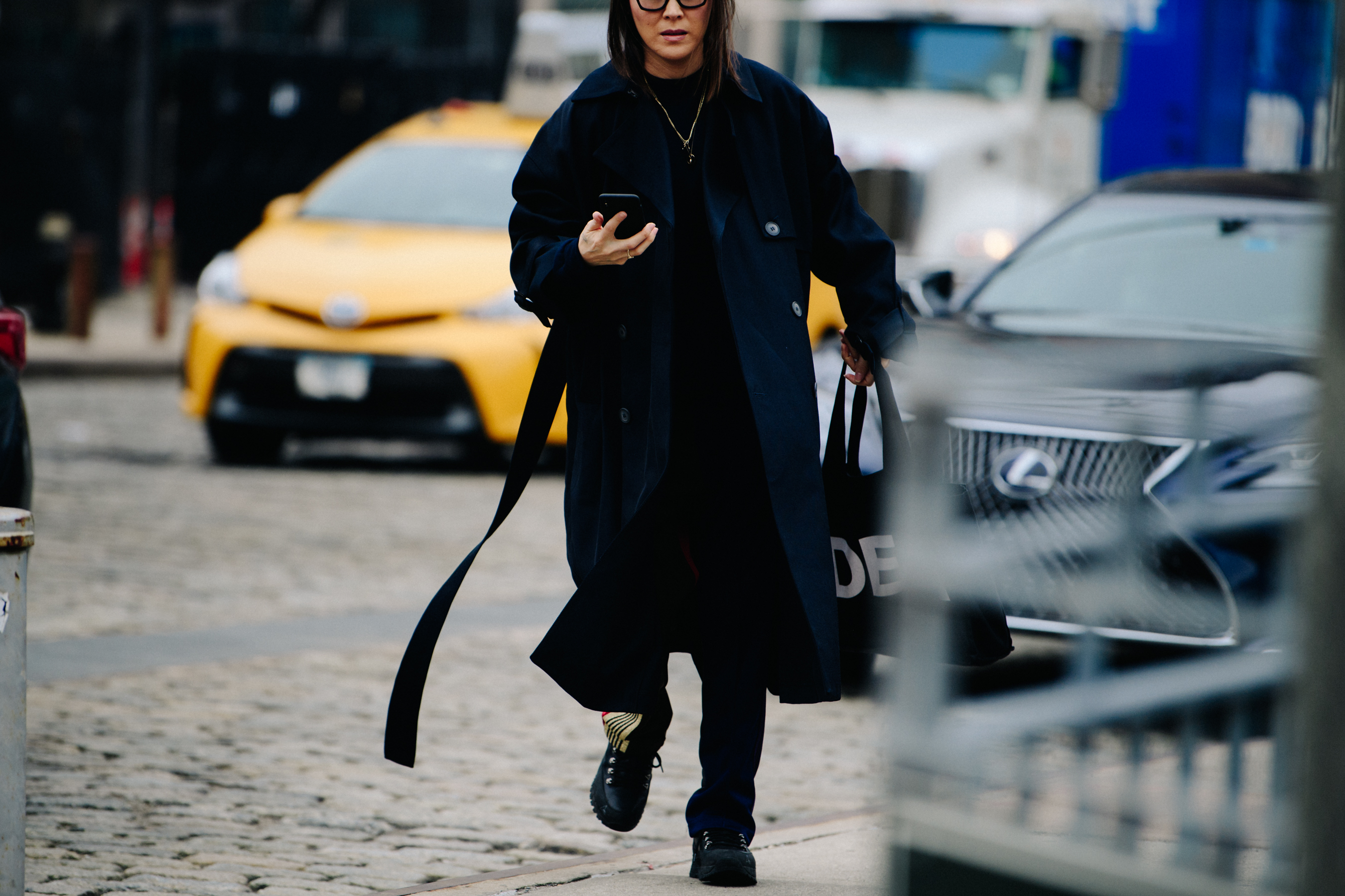 Woman wearing long blue coat