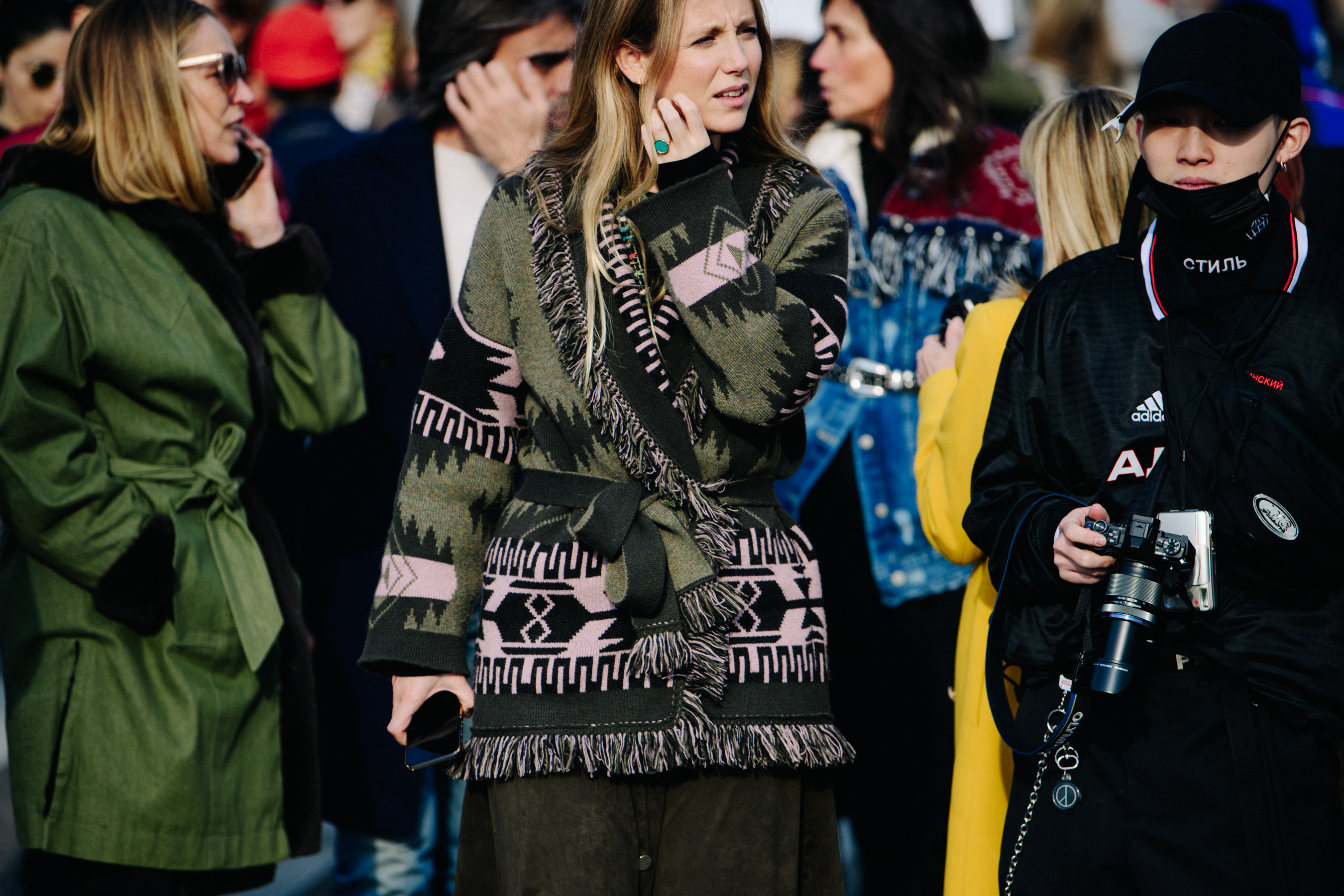 Woman wearing green and pink pattern jacket