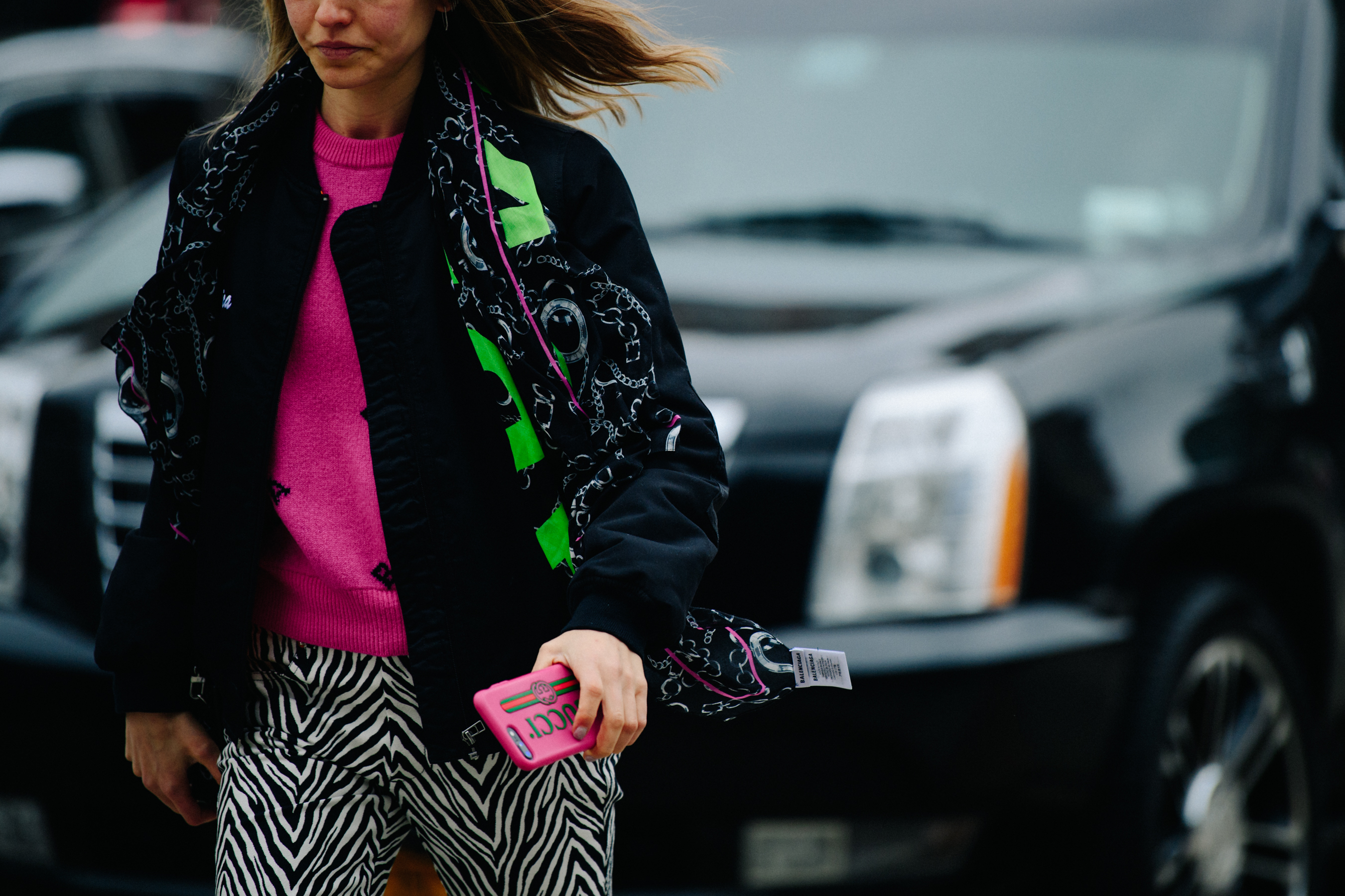 Woman wearing green and pink outfit