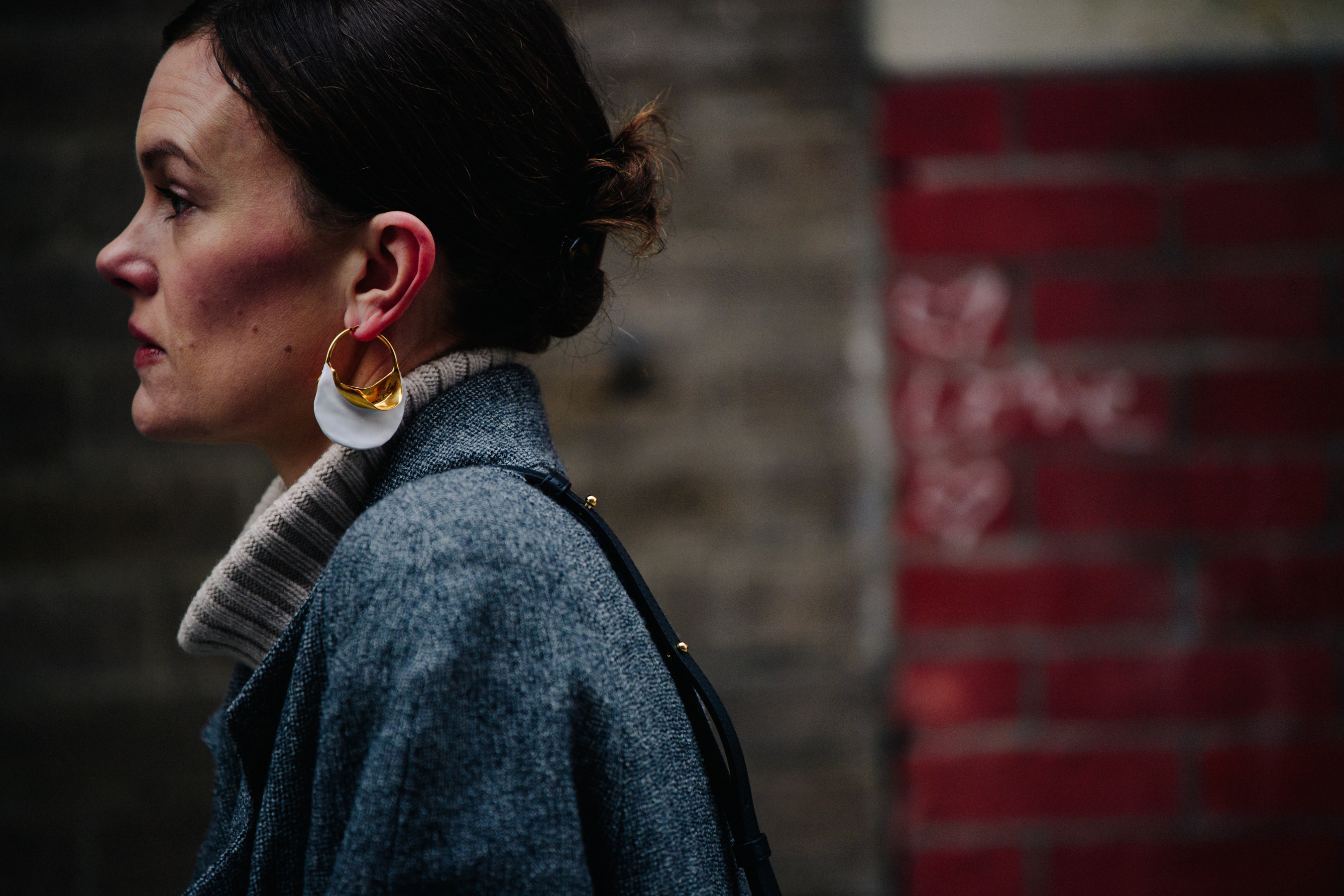 Editor wearing grey coat