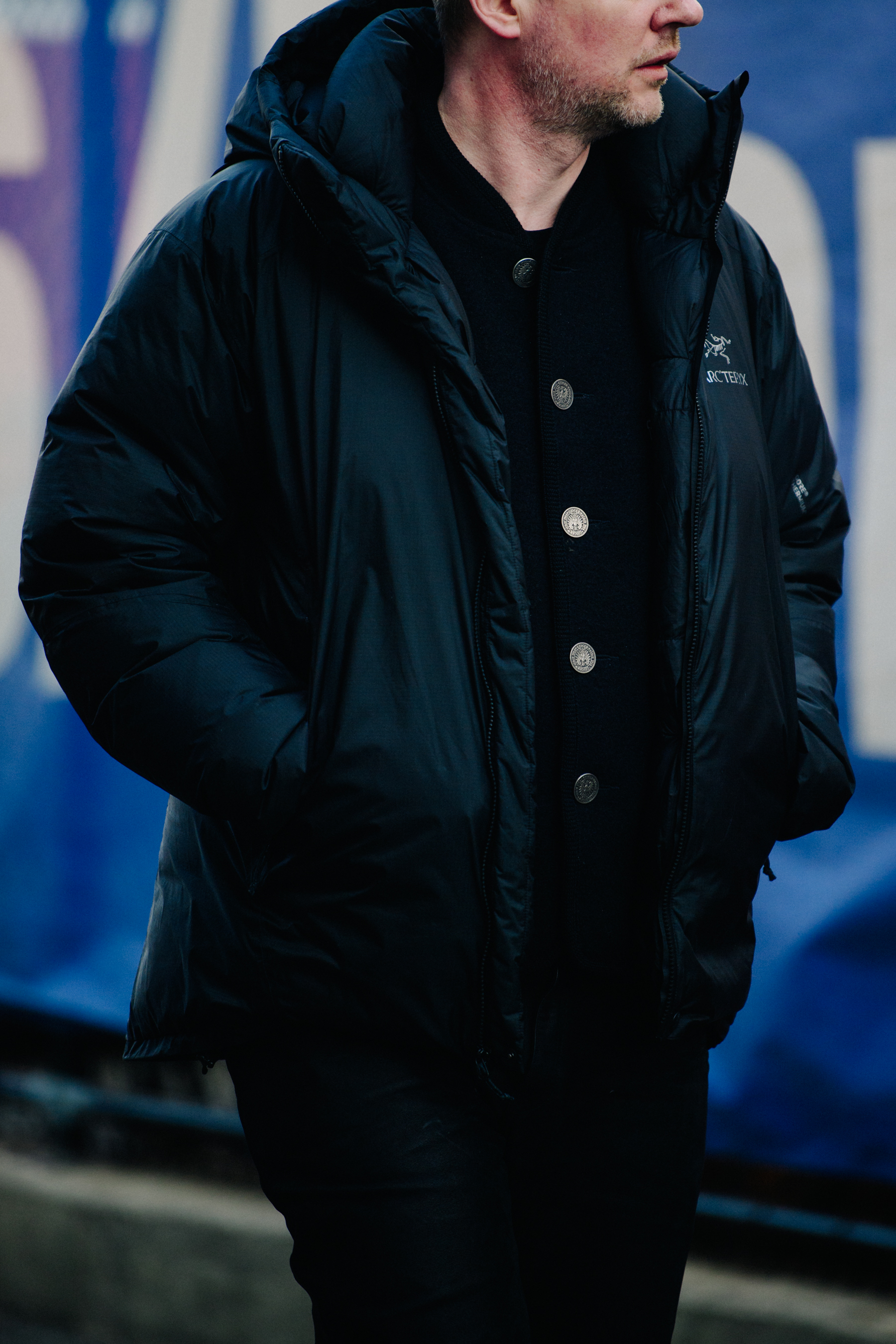 Man wearing black Arc'teryx jacket