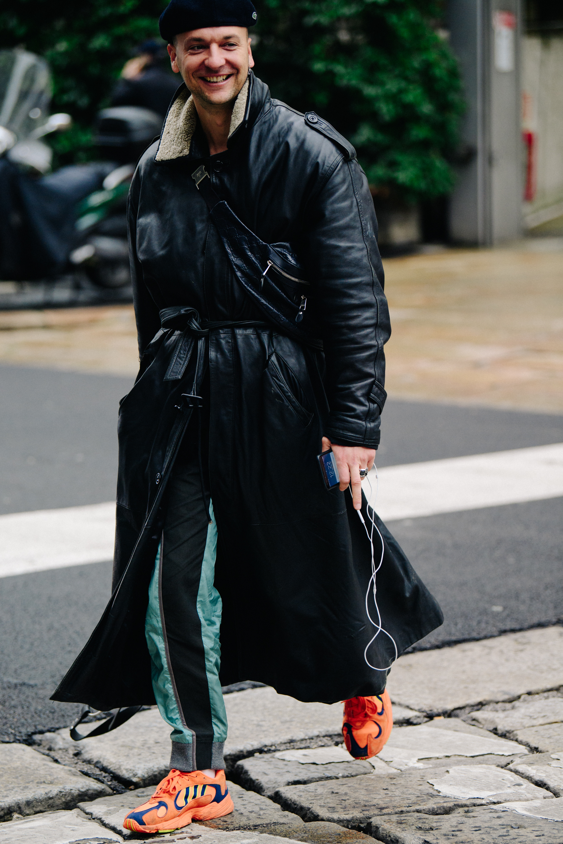 French photographer wearing long leather coat