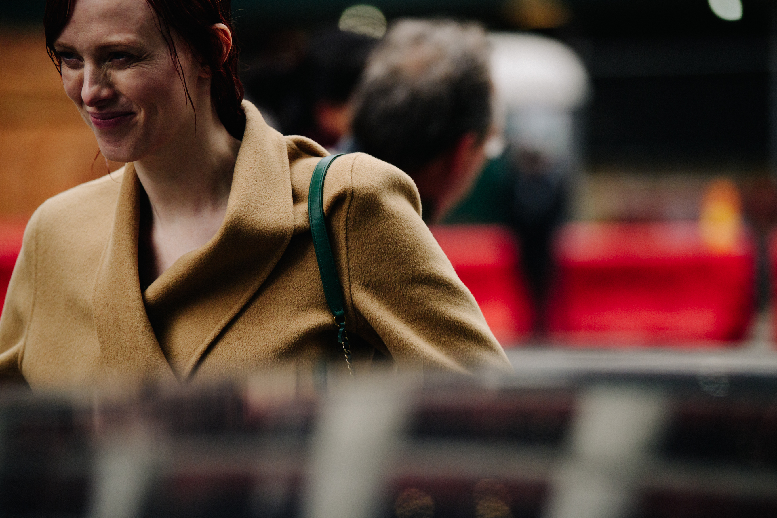 Woman wearing tan wool coat