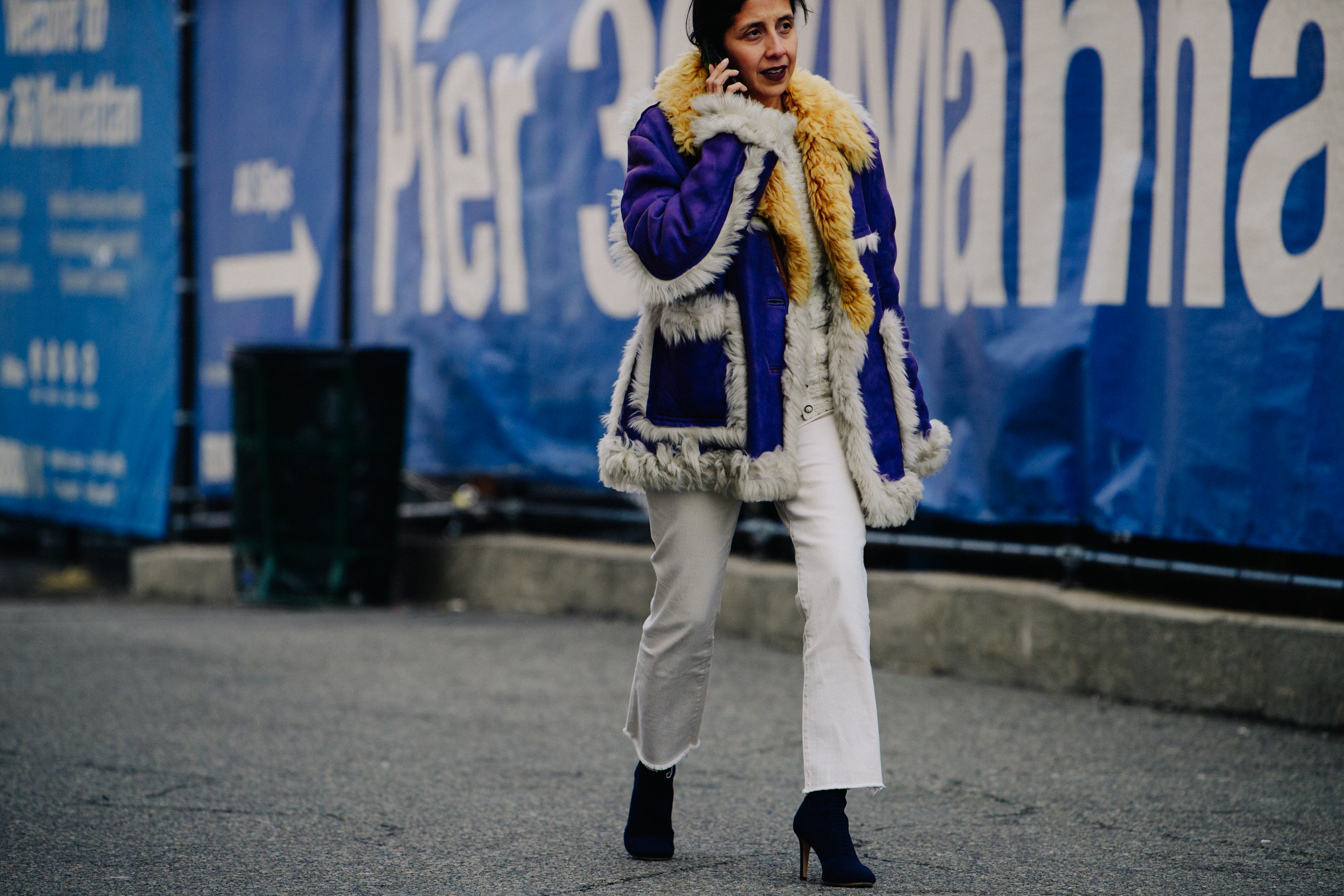 Woman wearing purple fur coat