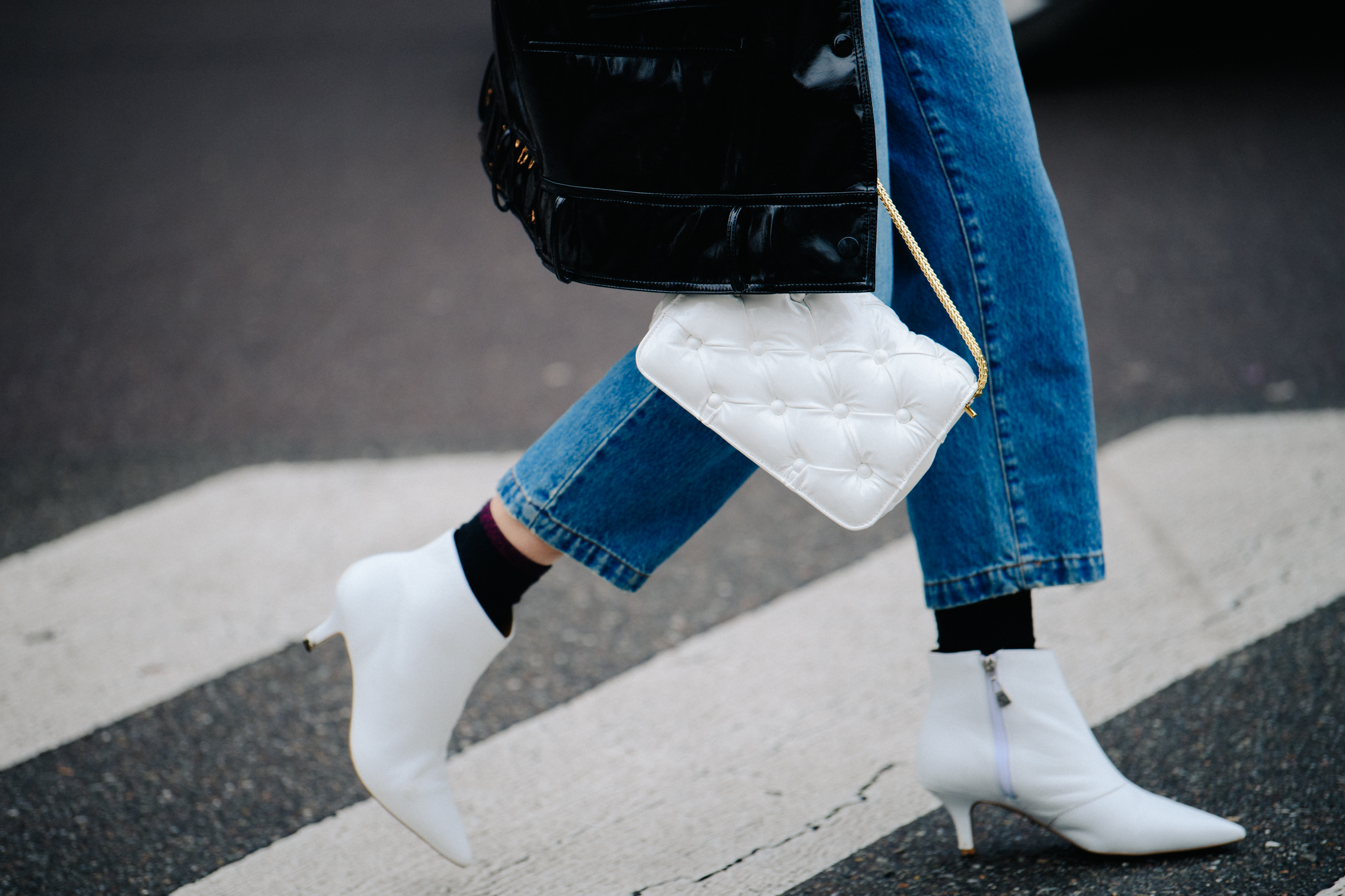 Woman wearing bright white heels