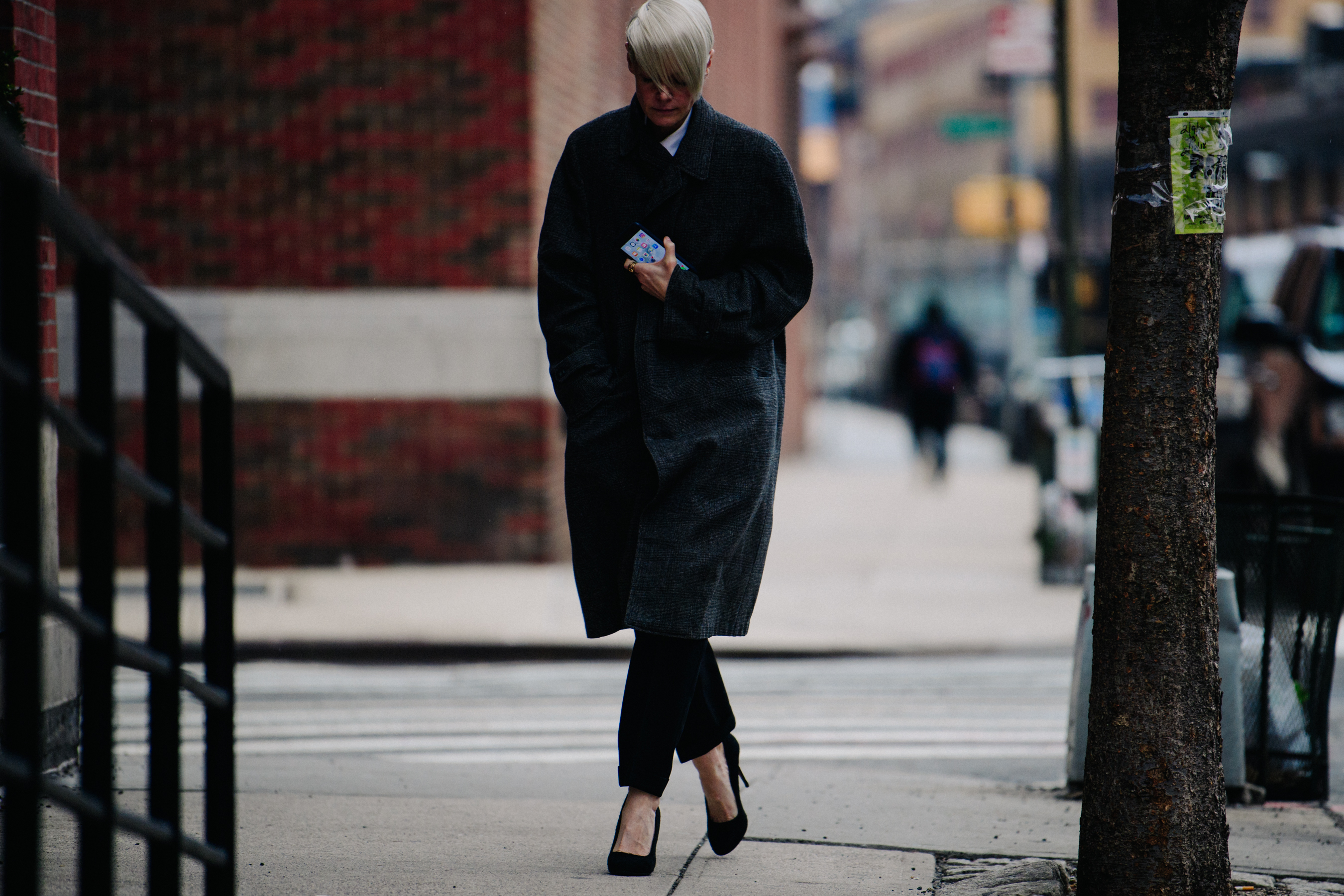 Woman wearing long grey coat