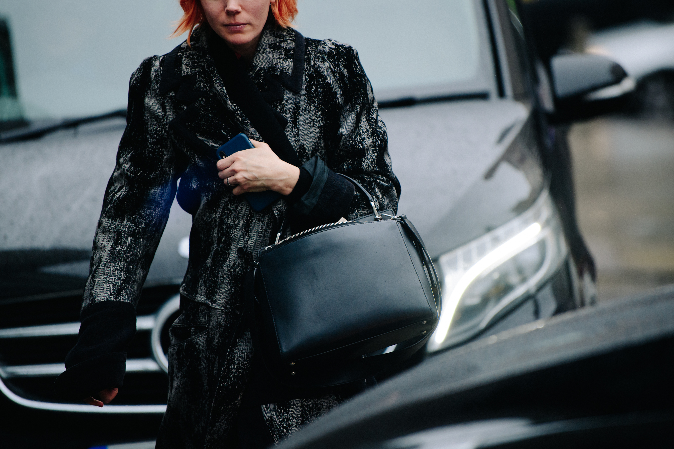Woman wearing black and white coat