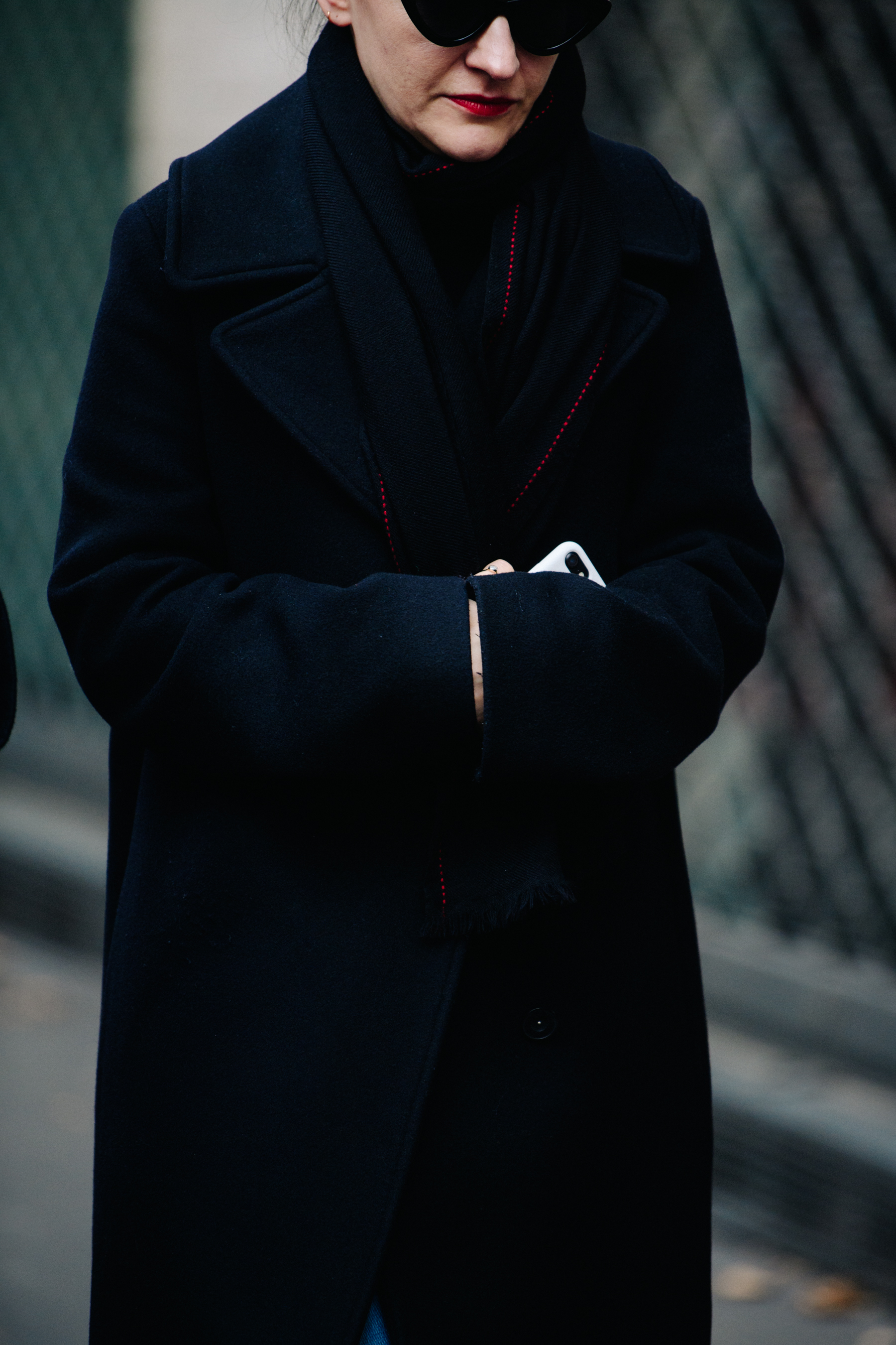 Woman wearing red and black scarf
