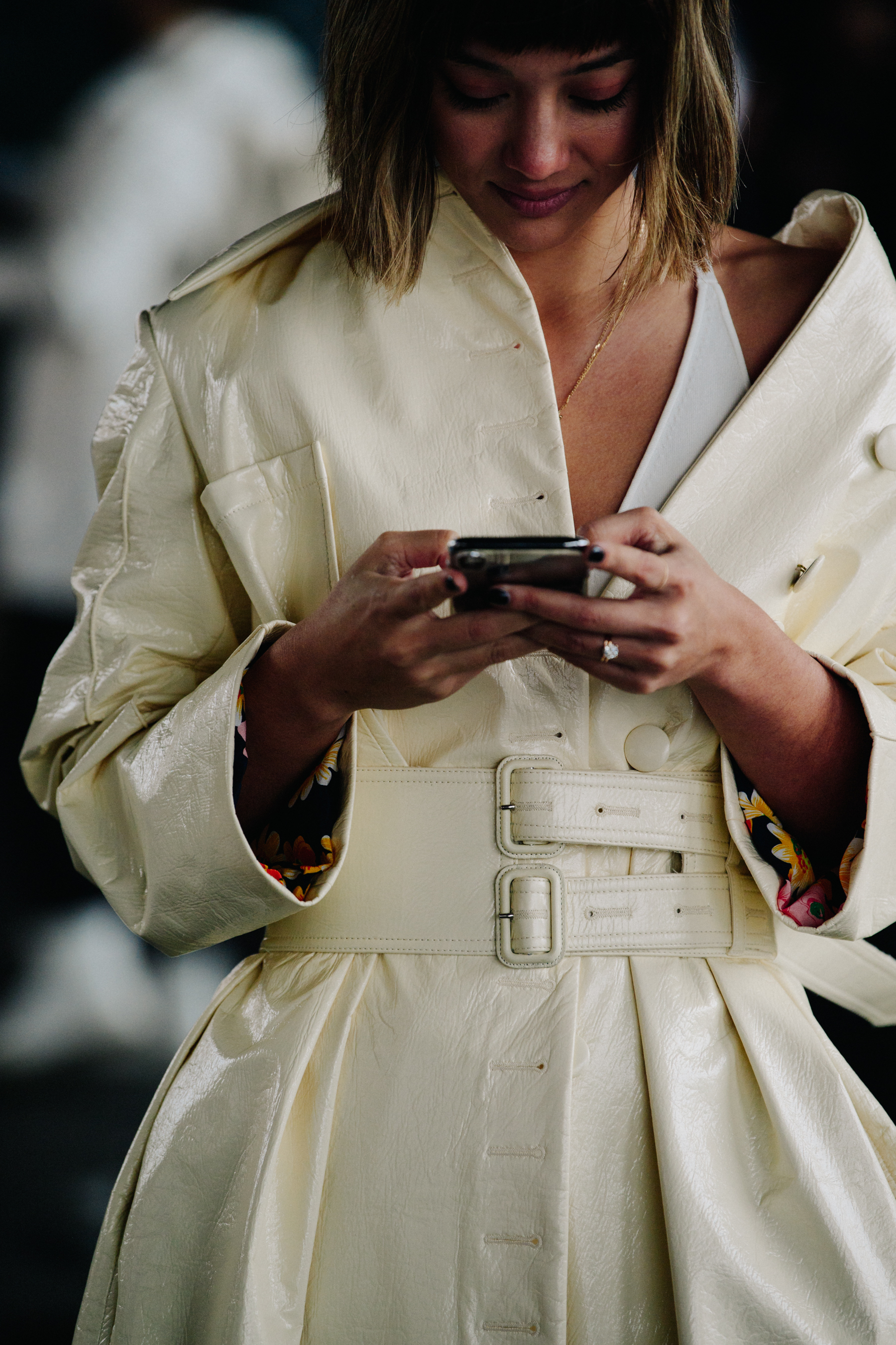 Blogger wearing white shiny coat