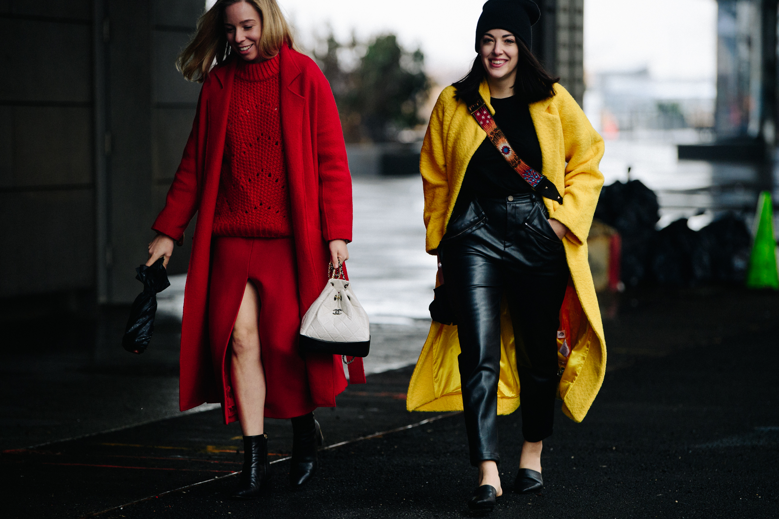 Two women wearing red and yellow