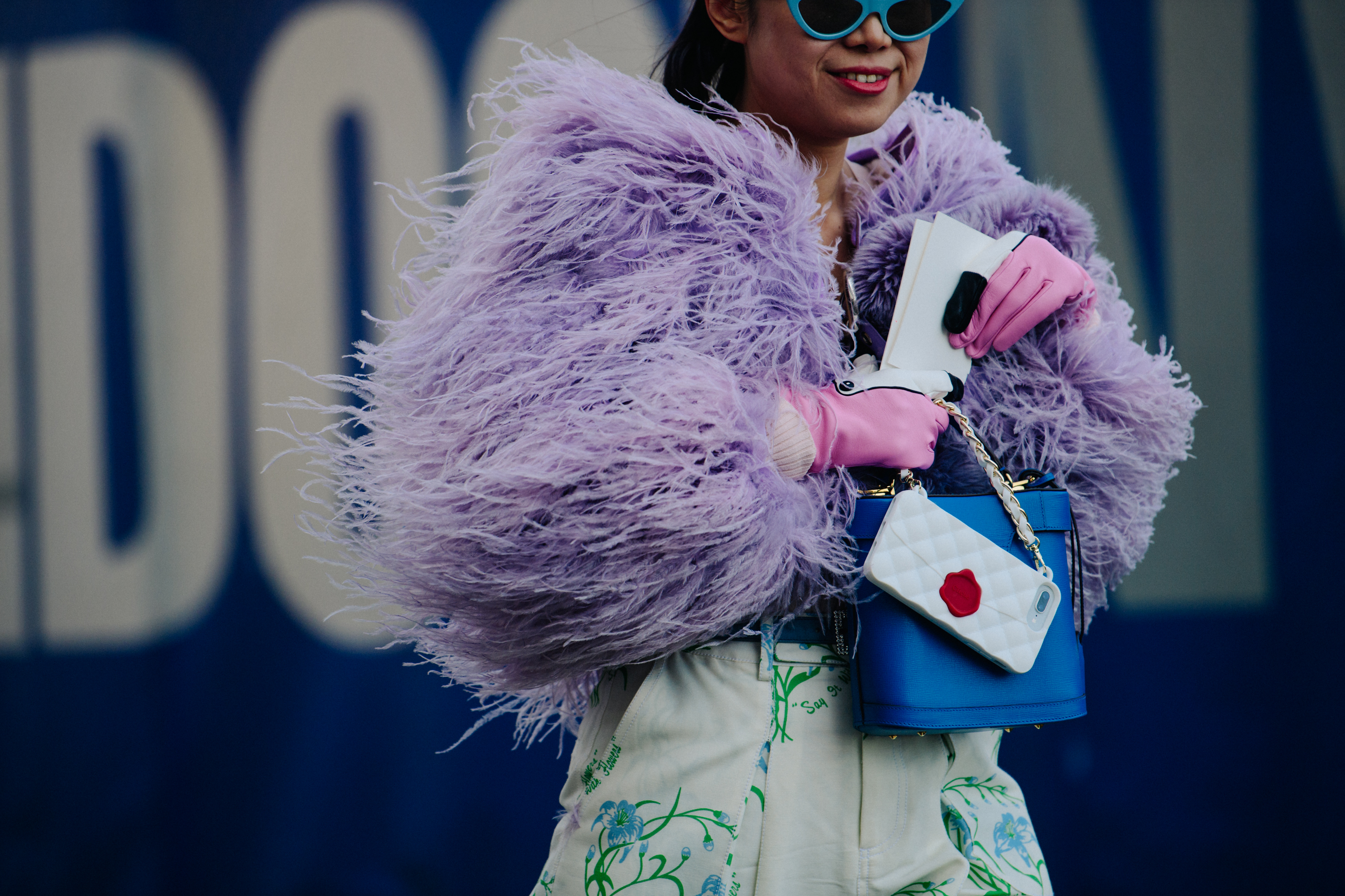 Woman wearing purple feather jacket