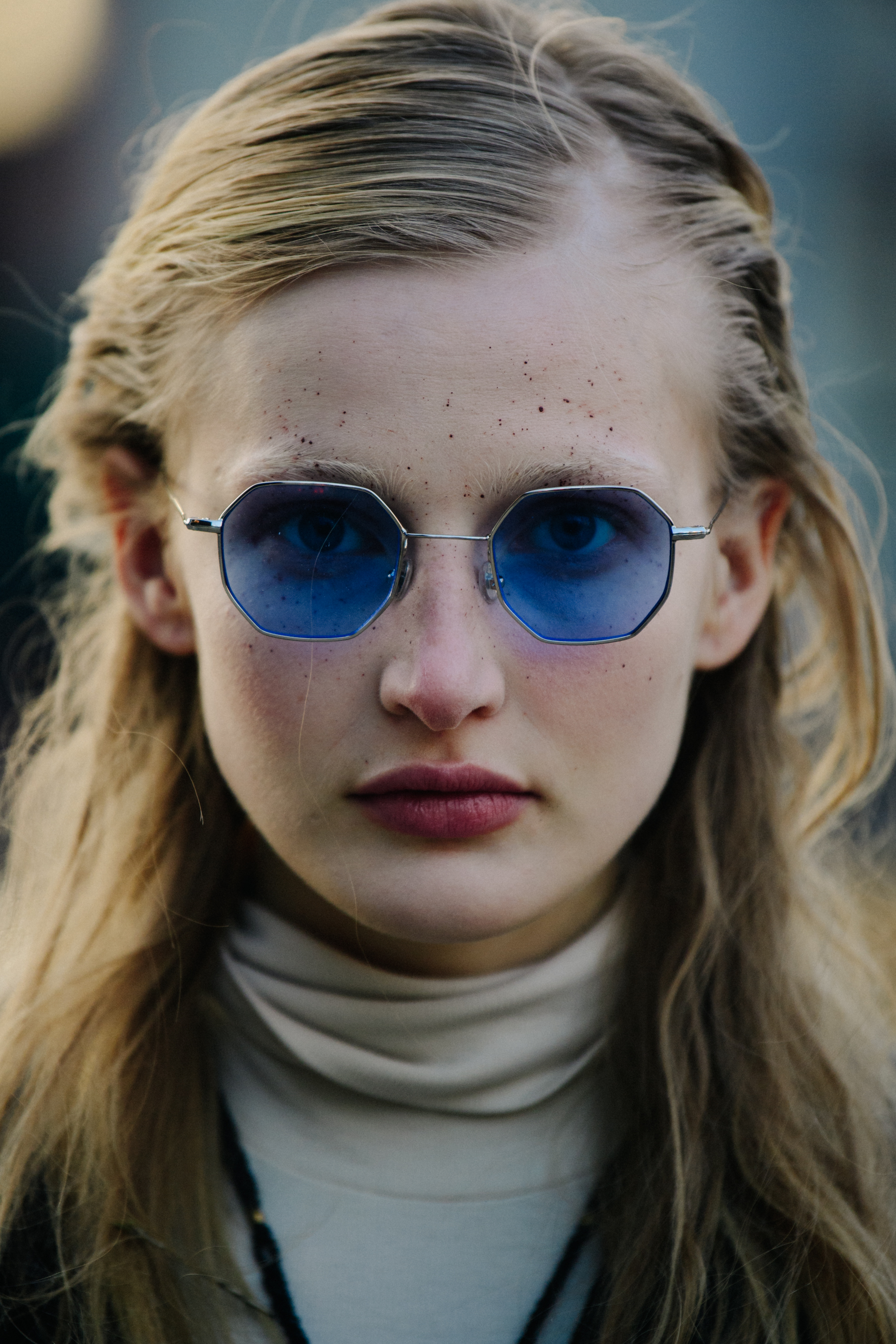 Portrait of model wearing blue sunglasses