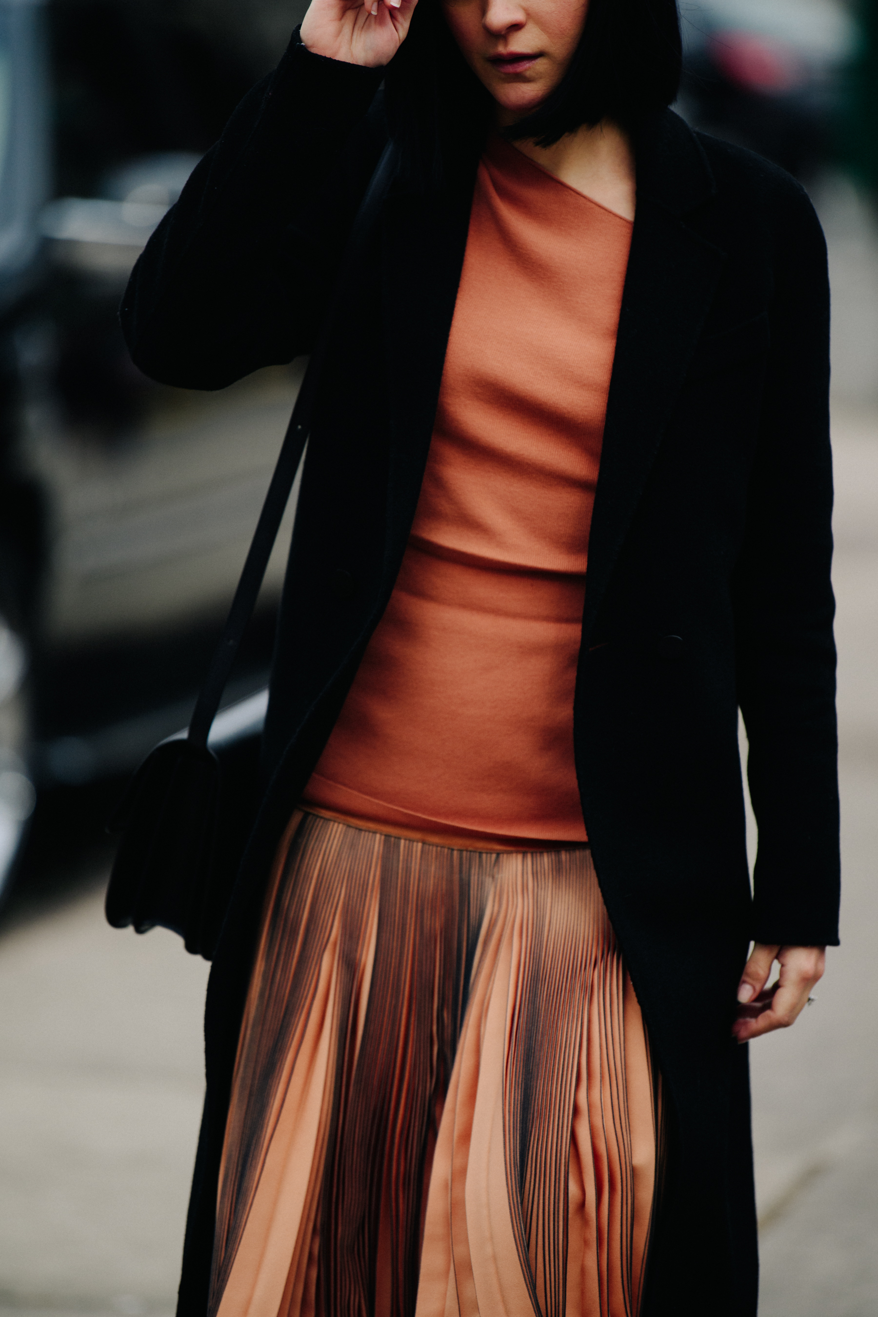 Woman wearing brown shirt and skirt