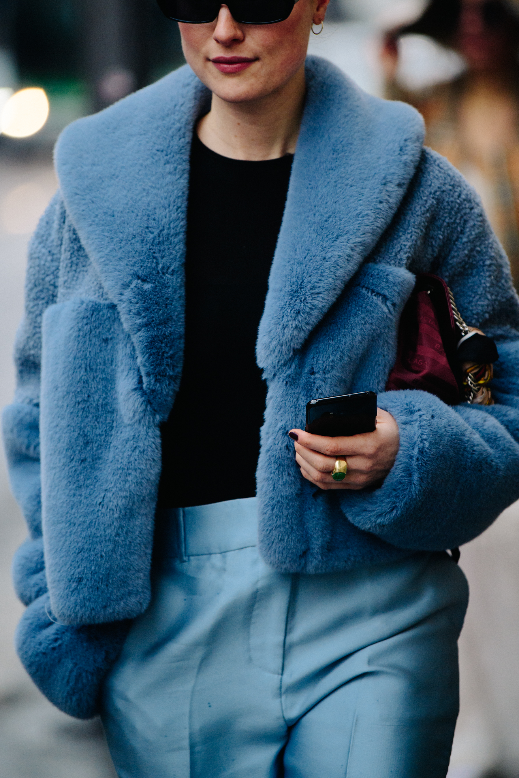 Woman wearing blue fur coat